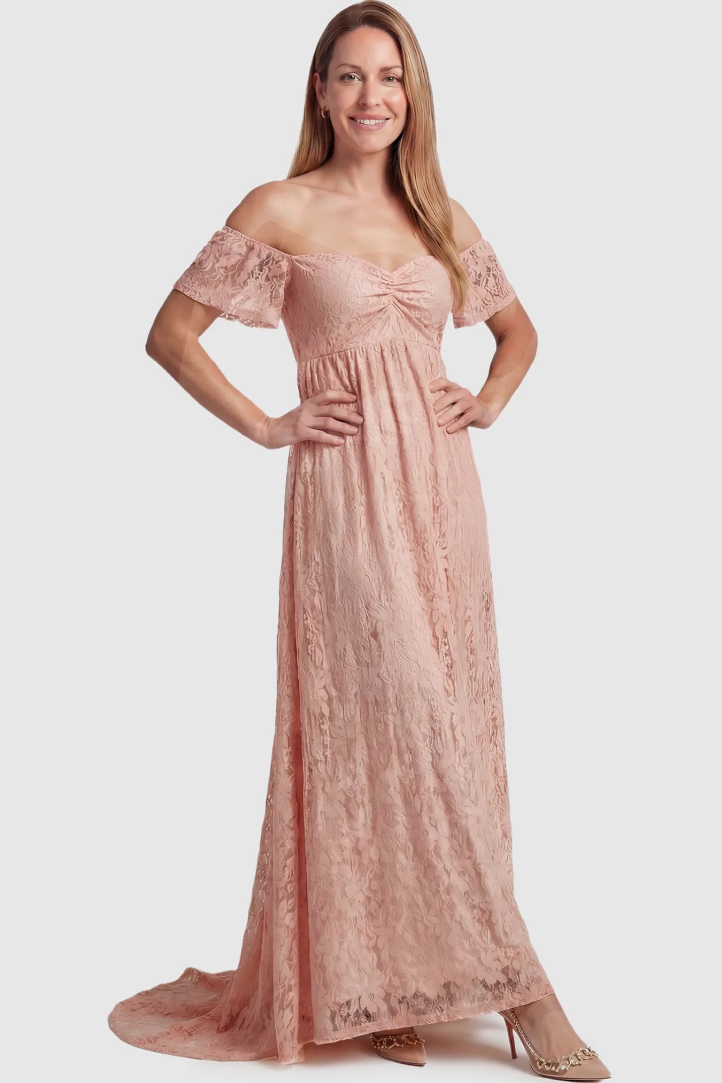 Lace Off Shoulder Maternity Maxi Dress Lace Off Shoulder Maternity Maxi Dress in blush pink featuring off the shoulder neckline on a postpartum model showing front.