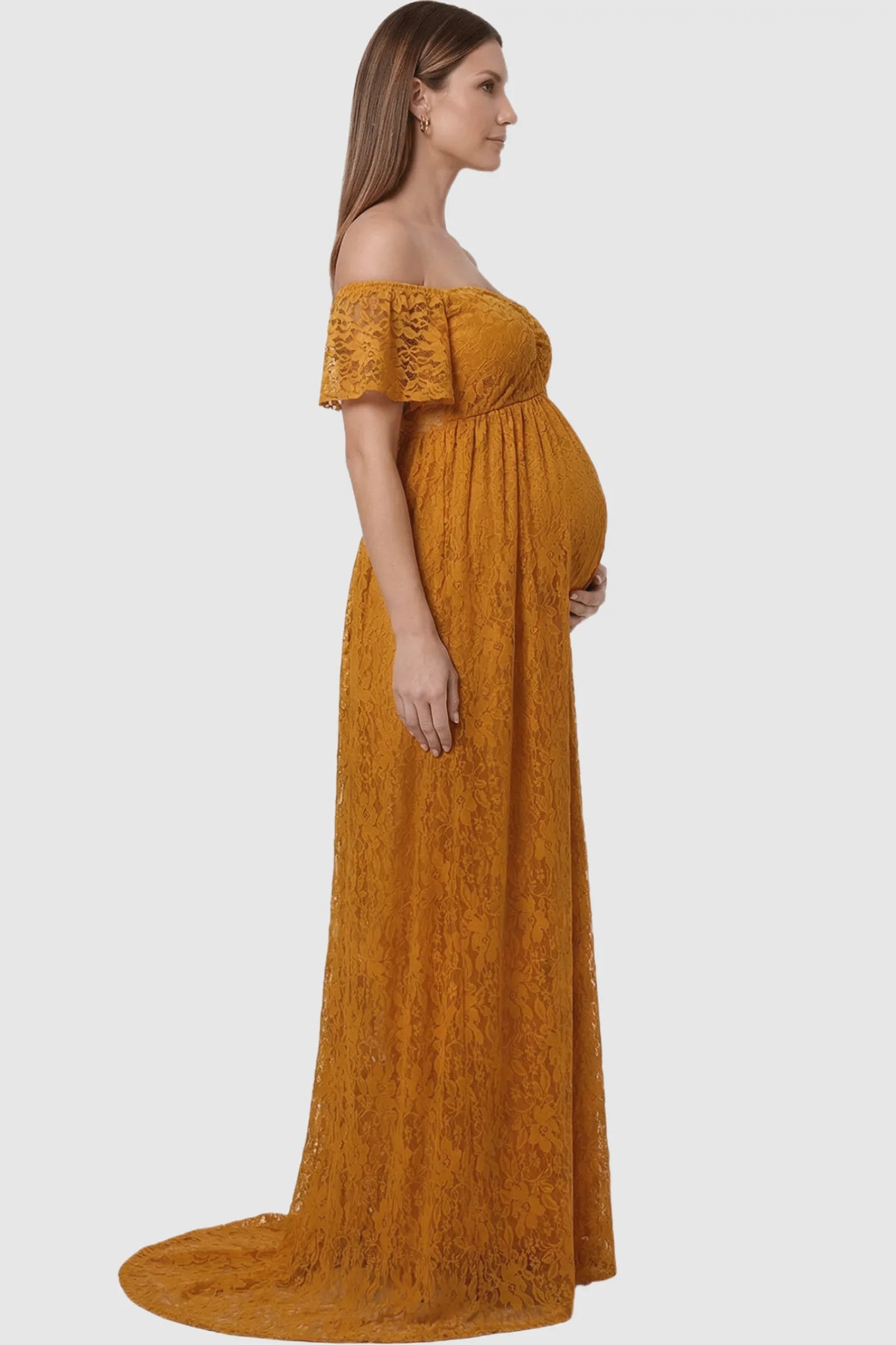 Lace Off Shoulder Maternity Maxi Dress Lace Off Shoulder Maternity Maxi Dress in gold featuring off the shoulder neckline on a pregnant model showing side.