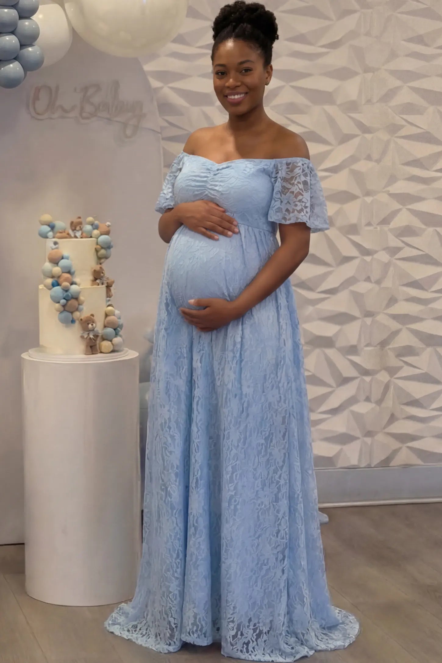 Lace Off Shoulder Maternity Maxi Dress Lace Off Shoulder Maternity Maxi Dress in light blue featuring off the shoulder neckline on a pregnant woman showing front.