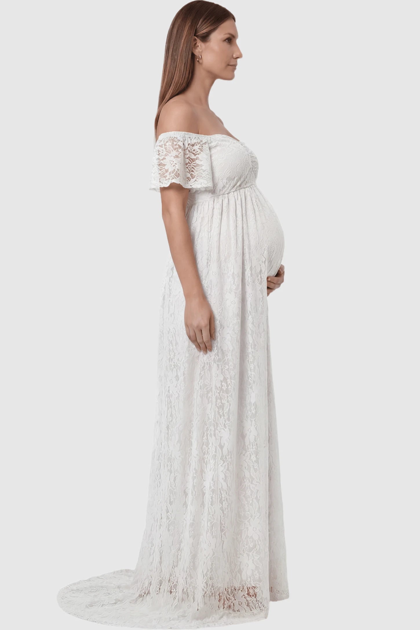 Lace Off Shoulder Maternity Maxi Dress Lace Off Shoulder Maternity Maxi Dress in white featuring off the shoulder neckline on a pregnant model showing side.