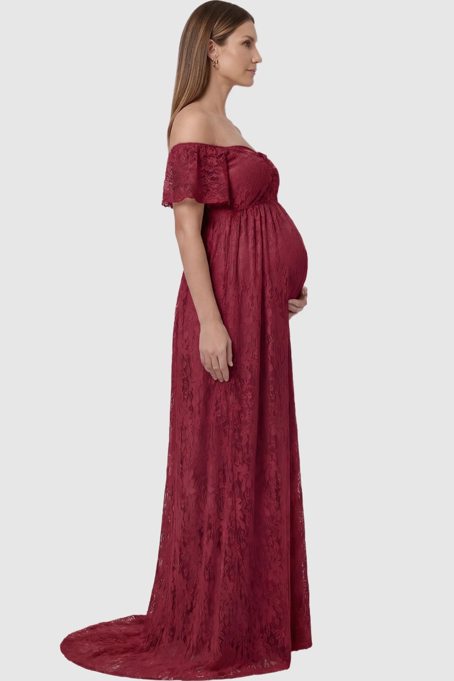 Lace Off Shoulder Maternity Maxi Dress Lace Off Shoulder Maternity Maxi Dress in Wine Red featuring off the shoulder neckline on a pregnant model showing side.