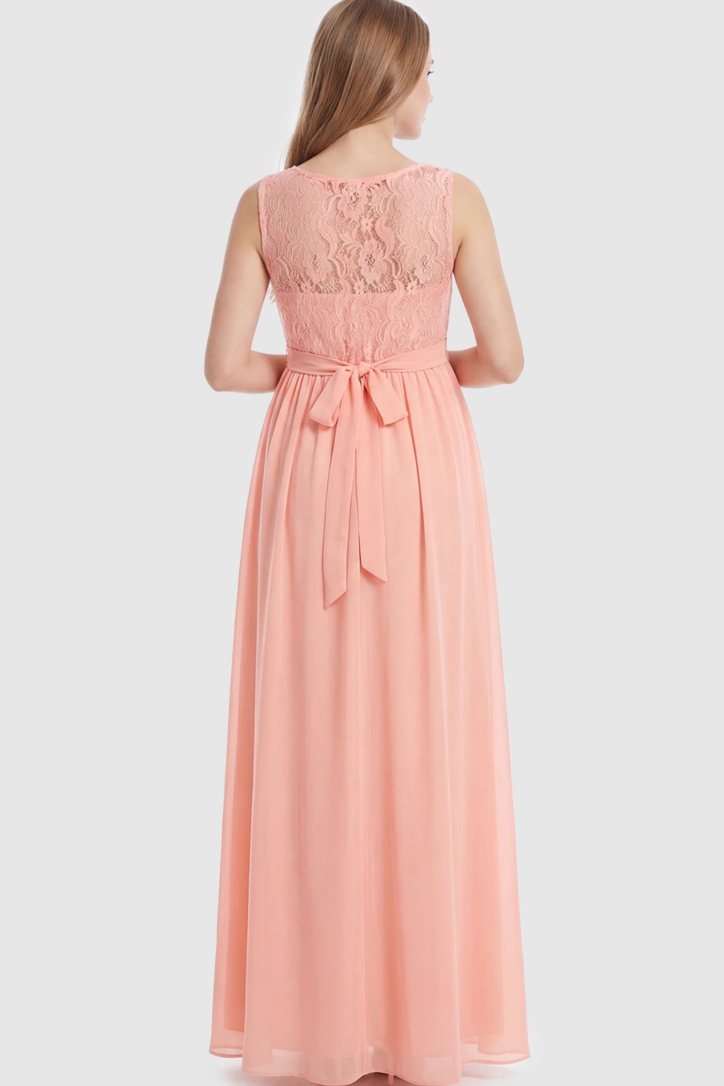 Floral Lace Sleeveless Maternity Maxi Dress Floral Lace Sleeveless Maternity Maxi Dress in Pink featuring a flowing skirt on a pregnant model showing back.
