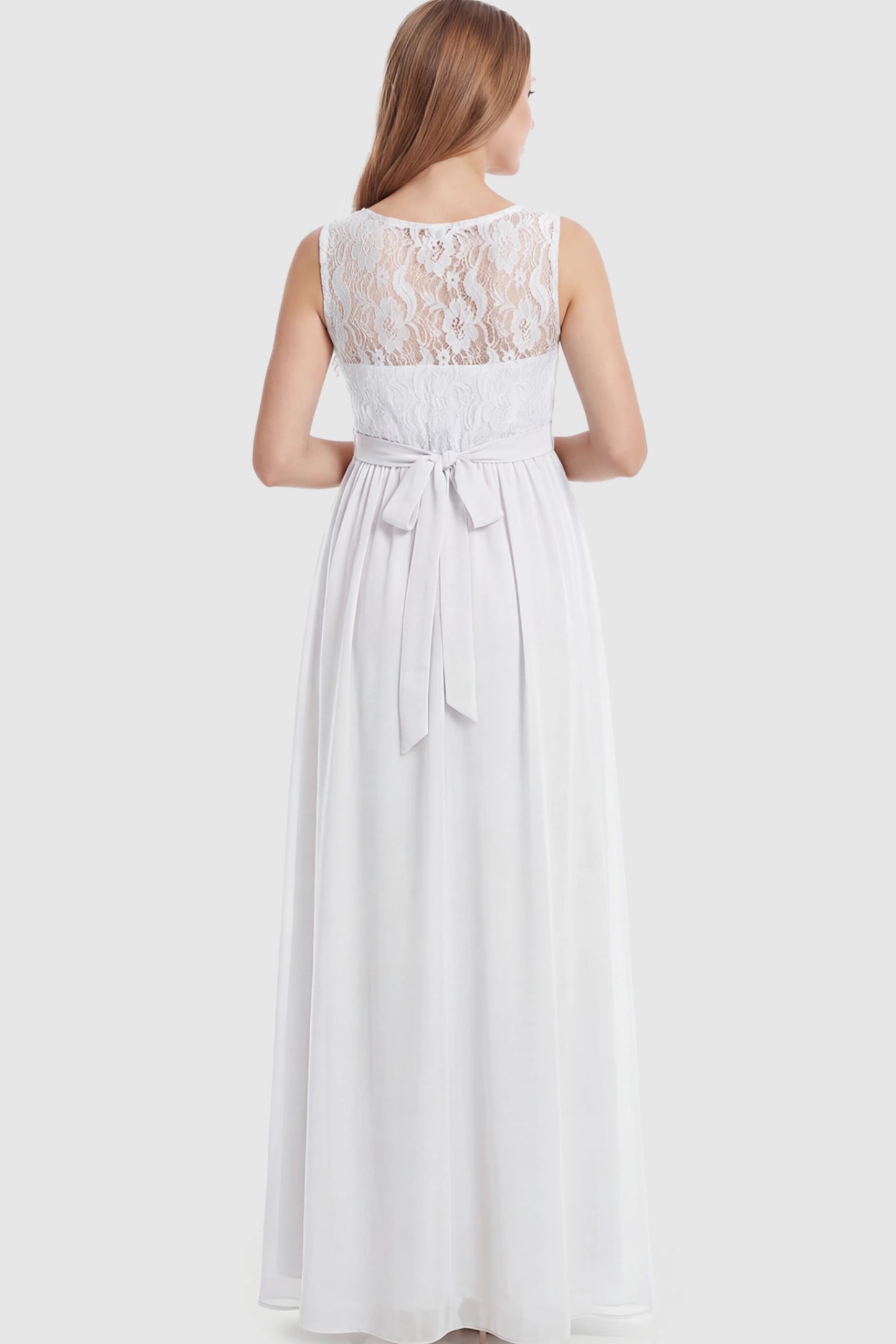 Floral Lace Sleeveless Maternity Maxi Dress Floral Lace Sleeveless Maternity Maxi Dress in White featuring a flowing skirt on a pregnant model showing back.