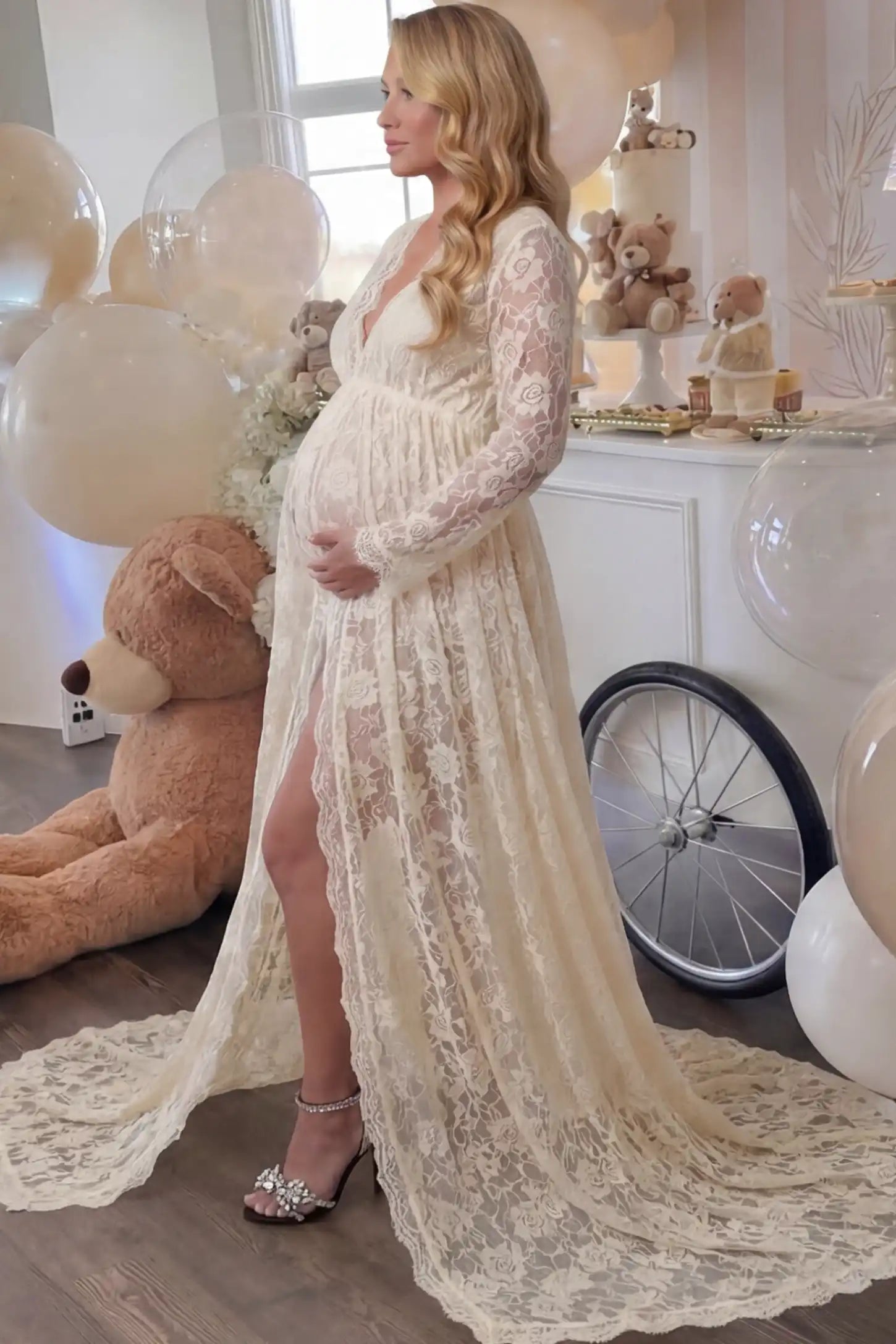 Floral Lace V-Neck Long Sleeve Maternity Photoshoot Gown Floral Lace V-Neck Long Sleeve Maternity Photoshoot Gown in Apricot featuring long sleeves and high front slit on a pregnant woman during home photoshoot.