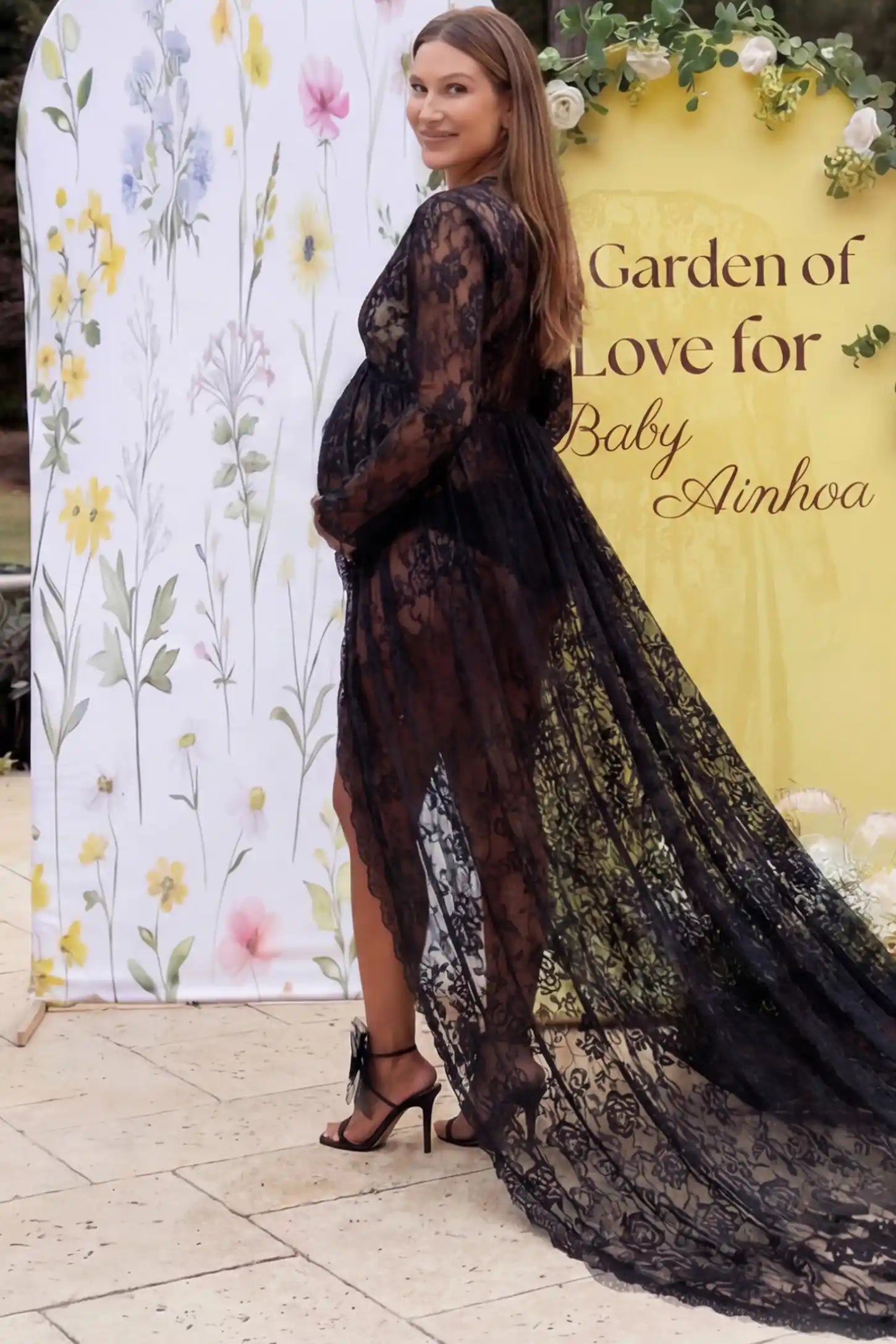 Floral Lace V-Neck Long Sleeve Maternity Photoshoot Gown Floral Lace V-Neck Long Sleeve Maternity Photoshoot Gown in Black featuring floor-length lace train on a pregnant model showing back.