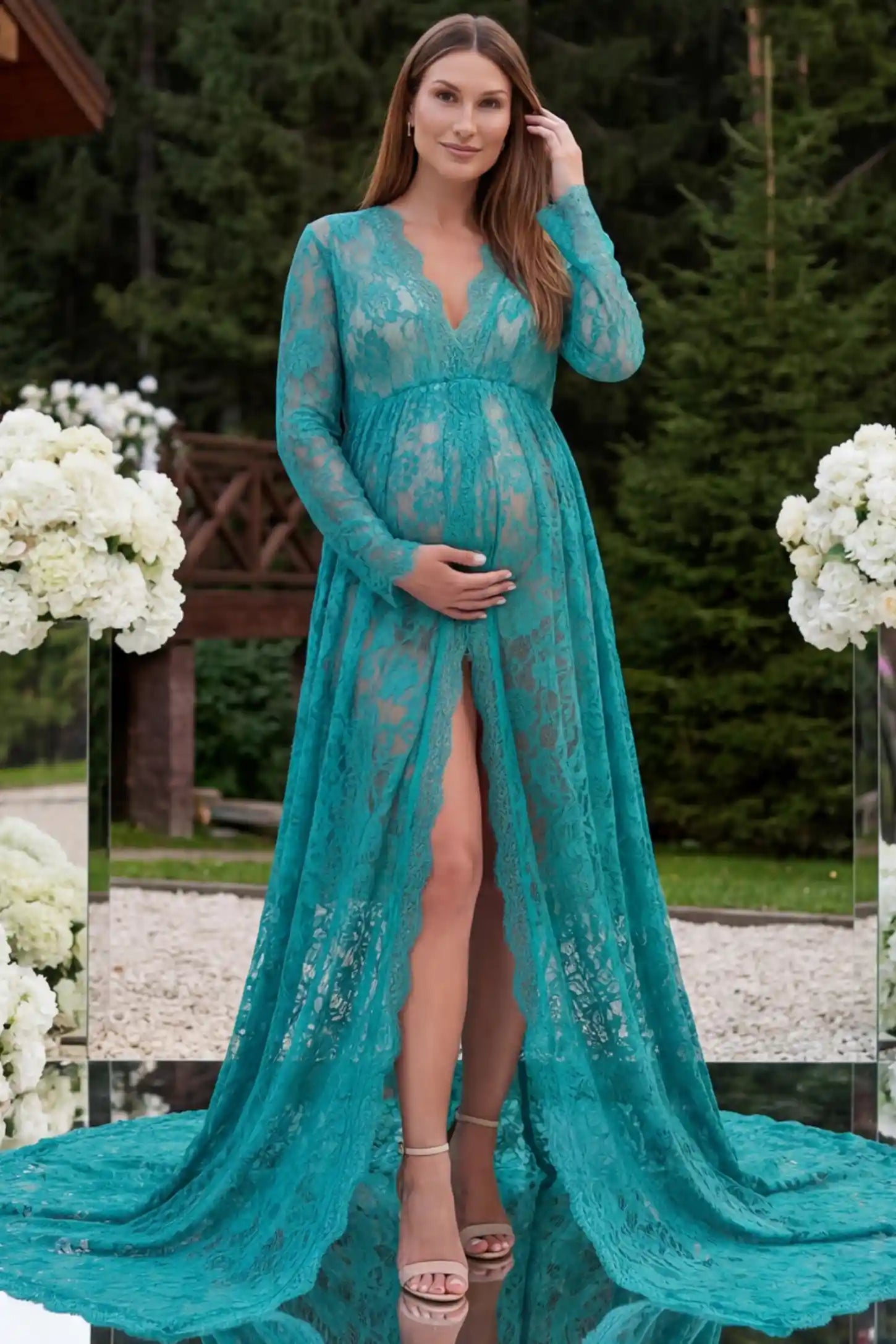 Floral Lace V-Neck Long Sleeve Maternity Photoshoot Gown Floral Lace V-Neck Long Sleeve Maternity Photoshoot Gown in Green featuring long sleeves and high front slit on a pregnant model posing front.
