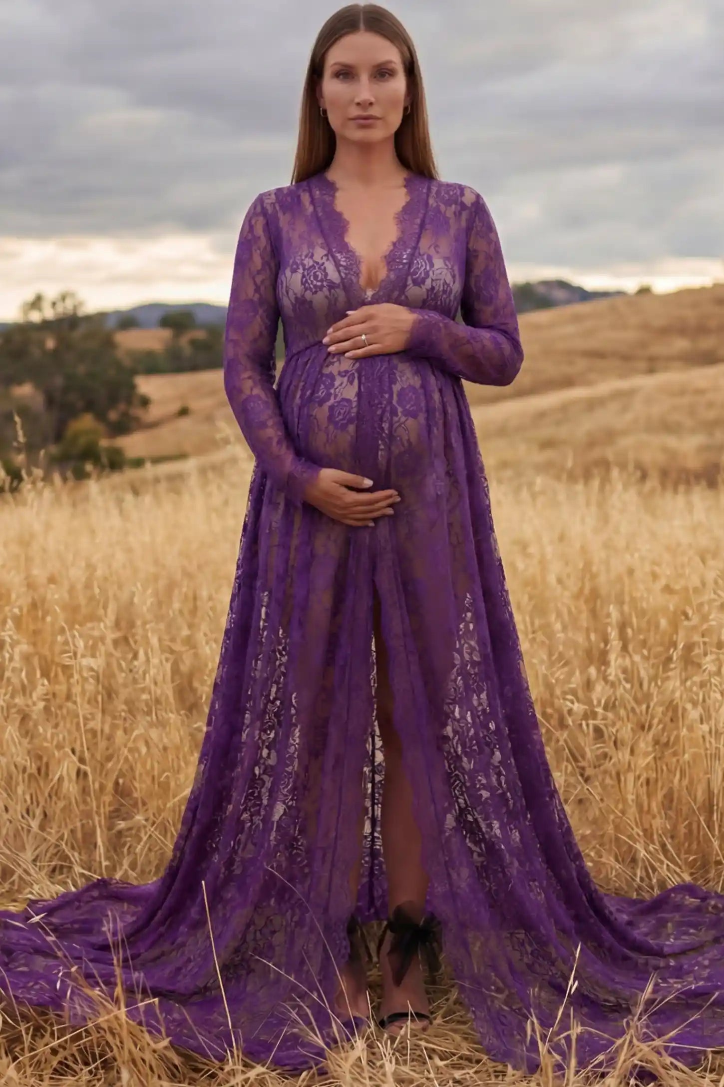 Floral Lace V-Neck Long Sleeve Maternity Photoshoot Gown Floral Lace V-Neck Long Sleeve Maternity Photoshoot Gown in Purple featuring long sleeves and high front slit on a pregnant model posing front.
