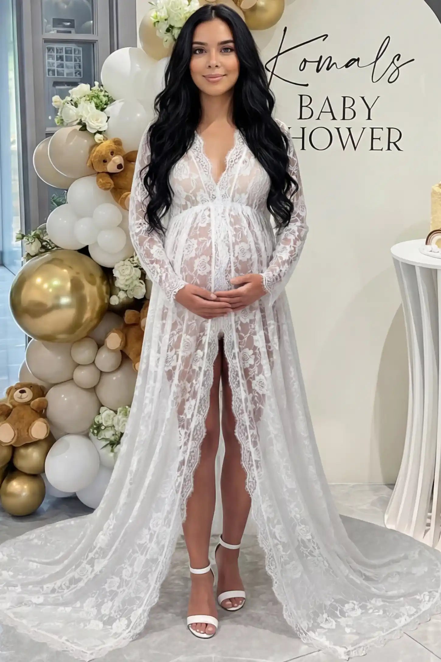 Floral Lace V-Neck Long Sleeve Maternity Photoshoot Gown Floral Lace V-Neck Long Sleeve Maternity Photoshoot Gown in White featuring long sleeves and high front slit on a pregnant woman during home photoshoot.