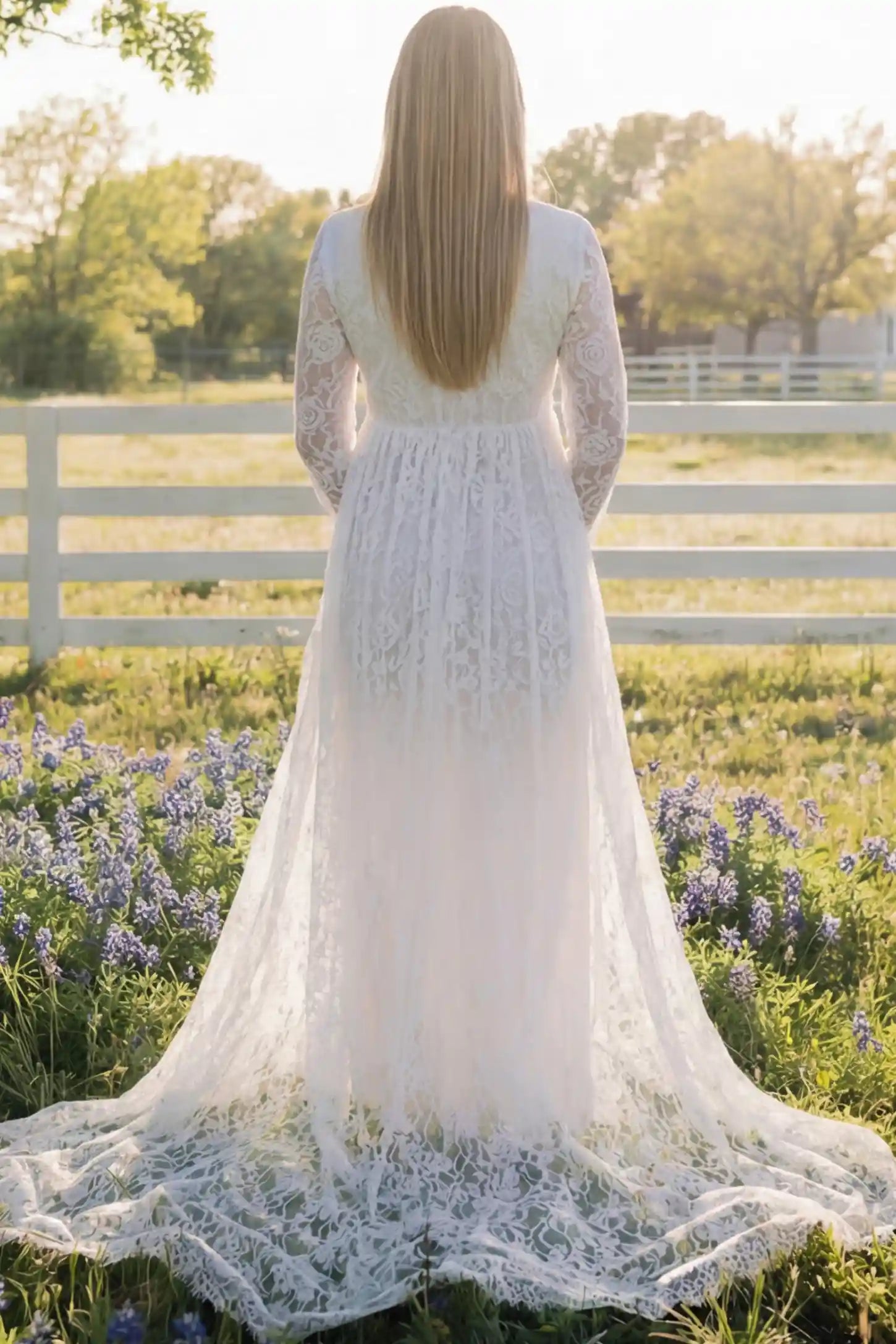 Floral Lace V-Neck Long Sleeve Maternity Photoshoot Gown Floral Lace V-Neck Long Sleeve Maternity Photoshoot Gown in White featuring floor-length lace train on a pregnant model showing back.