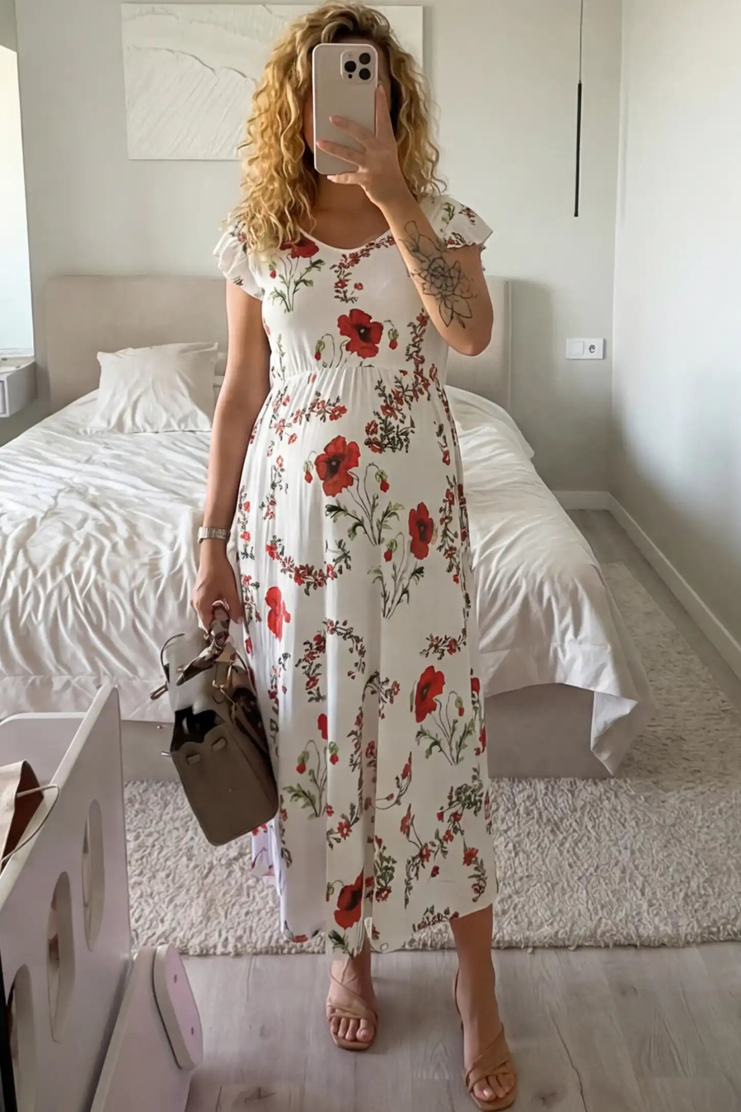 Floral Print Scoop Neck Maternity Maxi Dress Floral Print Scoop Neck Maxi Maternity Dress in White with Red Poppy Prints featuring ruffle sleeves on a pregnant woman front view.