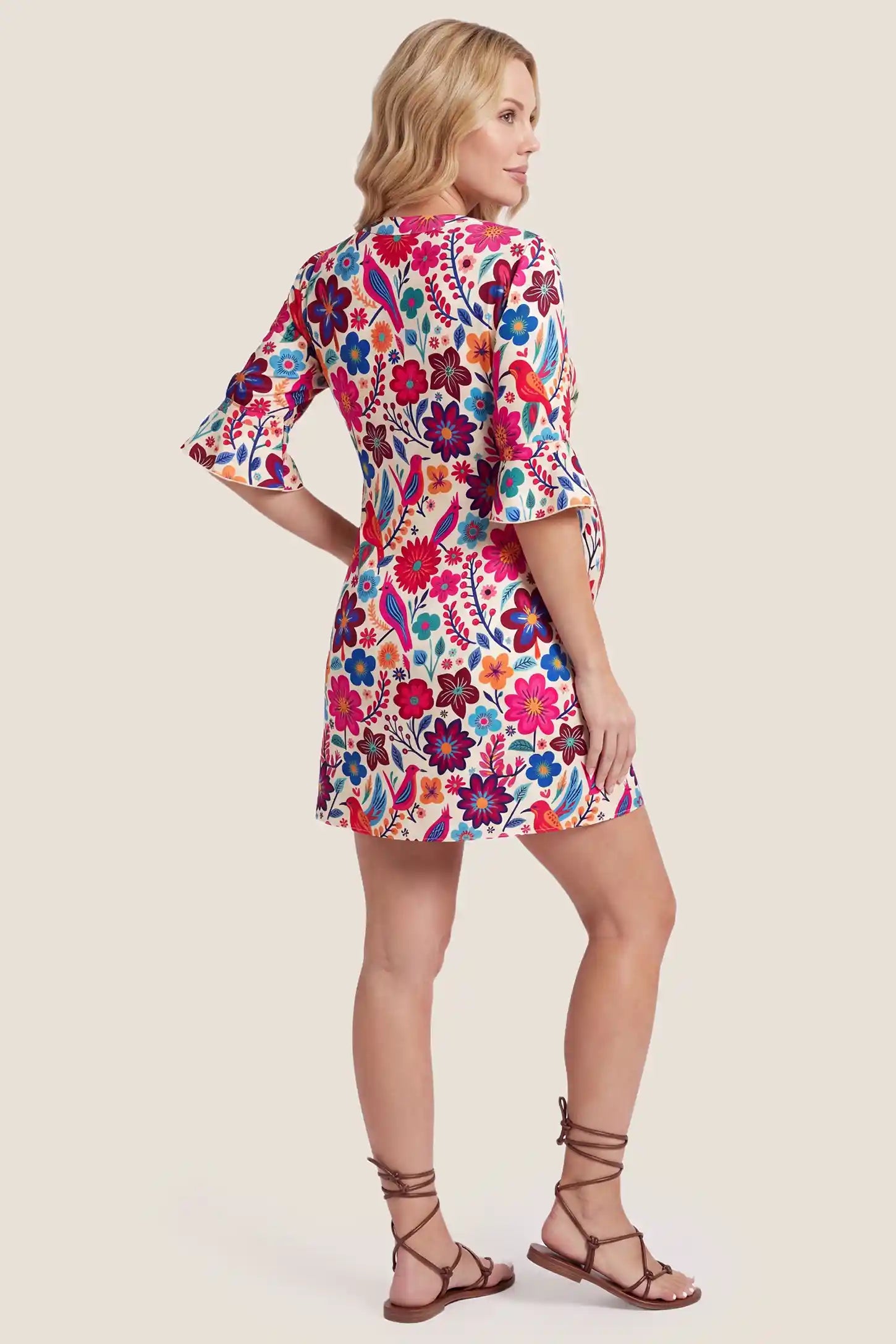 Floral Print V-Neck Flutter Sleeve Short Maternity Dress Floral Print V-Neck Flutter Sleeve Short Maternity Dress in red floral print showing the V-neck and short length, back view on a pregnant model.