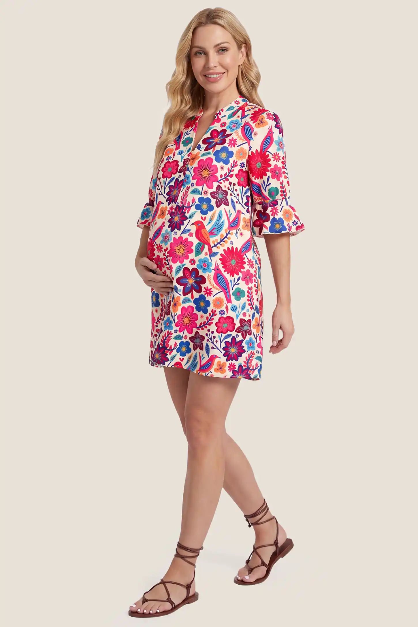 Floral Print V-Neck Flutter Sleeve Short Maternity Dress Floral Print V-Neck Flutter Sleeve Short Maternity Dress in red floral print with a flowy A-line cut, side view on a pregnant model.