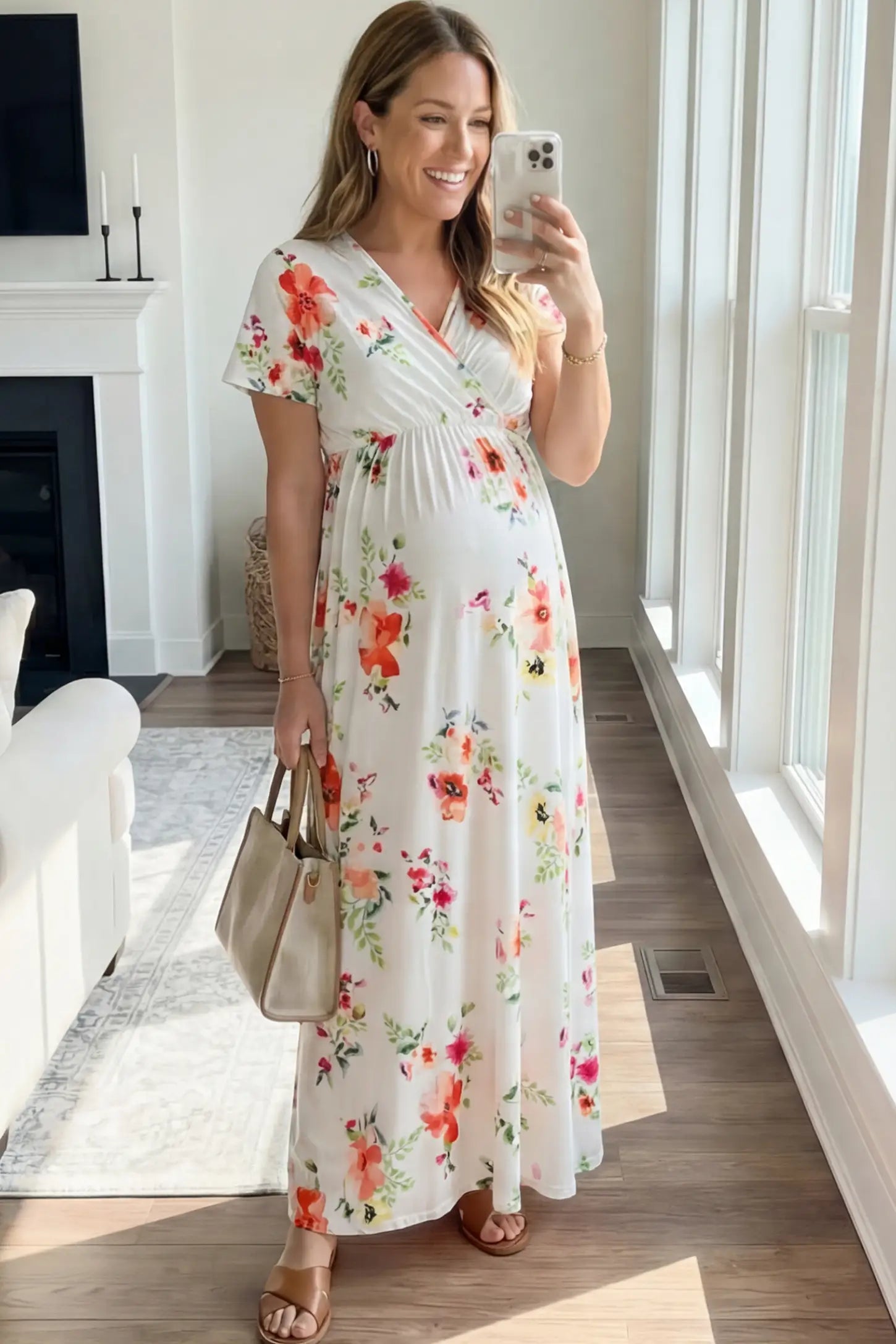 Floral Print V-Neck Maternity Maxi Dress Floral Print V-Neck Maternity Maxi Dress in White featuring a vibrant floral pattern on a pregnant woman showing front.
