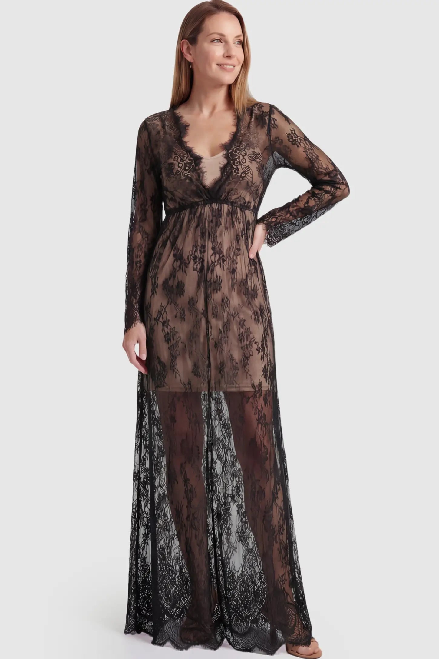 Floral Sheer Lace Long Sleeve Maternity Photoshoot Gown Floral Sheer Lace Maternity Gown in Black featuring scalloped v-neck and long sleeves on a postpartum model showing front.