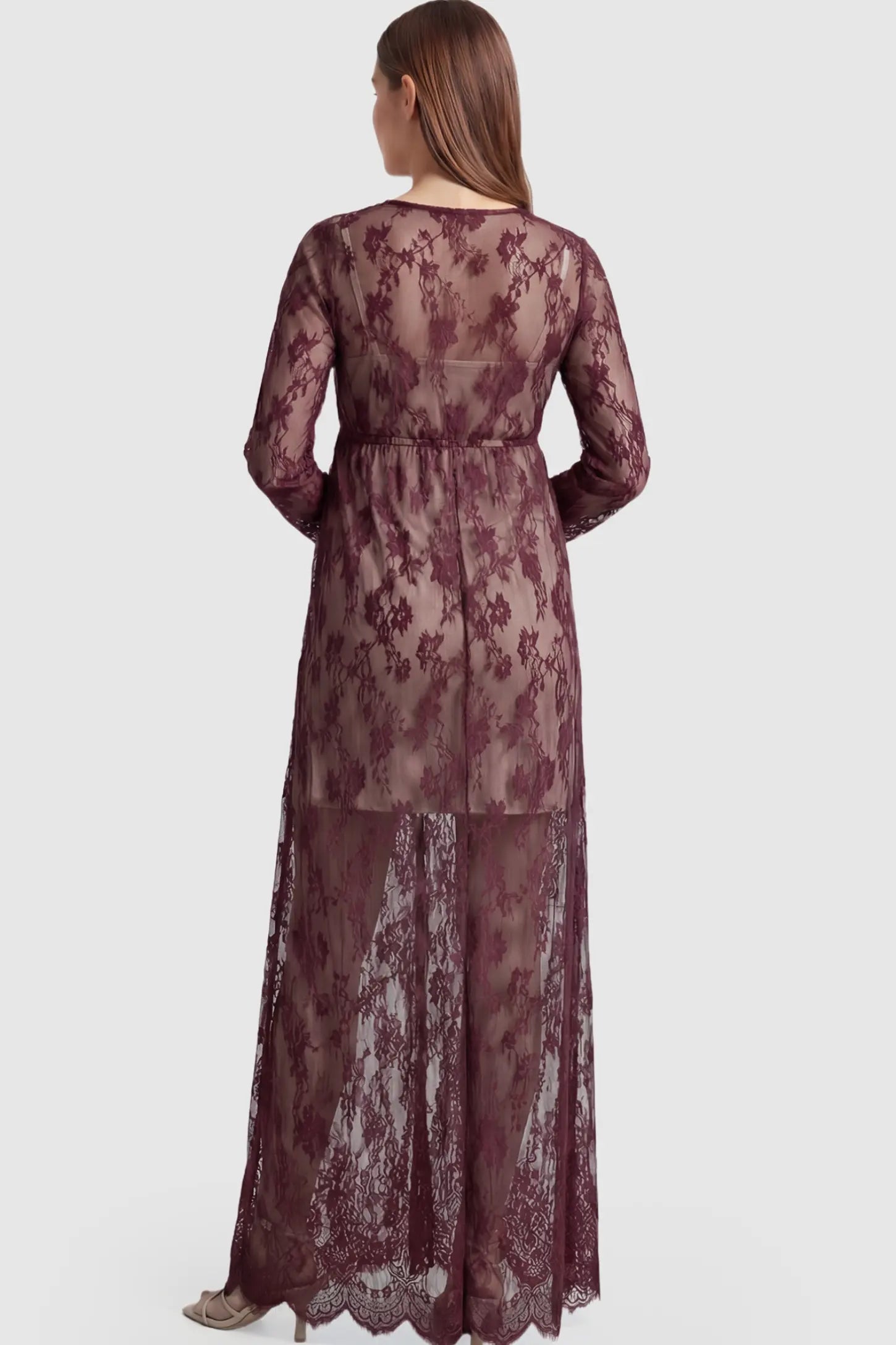 Floral Sheer Lace Long Sleeve Maternity Photoshoot Gown Floral Sheer Lace Maternity Gown in Burgundy featuring long sleeves on a pregnant model showing back.