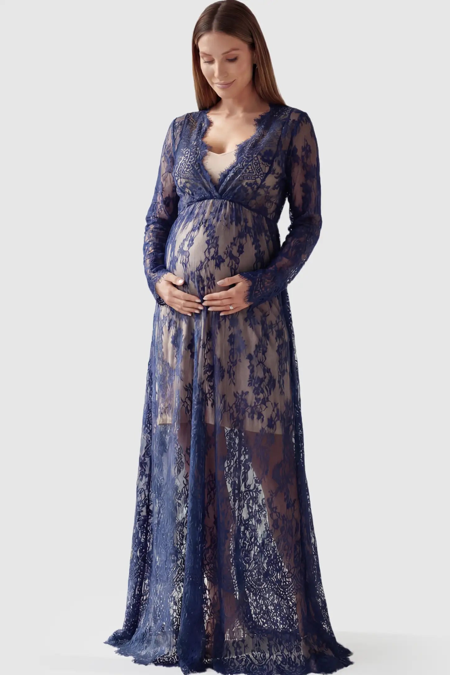 Floral Sheer Lace Long Sleeve Maternity Photoshoot Gown Floral Sheer Lace Maternity Gown in Dark Blue featuring scalloped v-neck and long sleeves on a pregnant model showing front.
