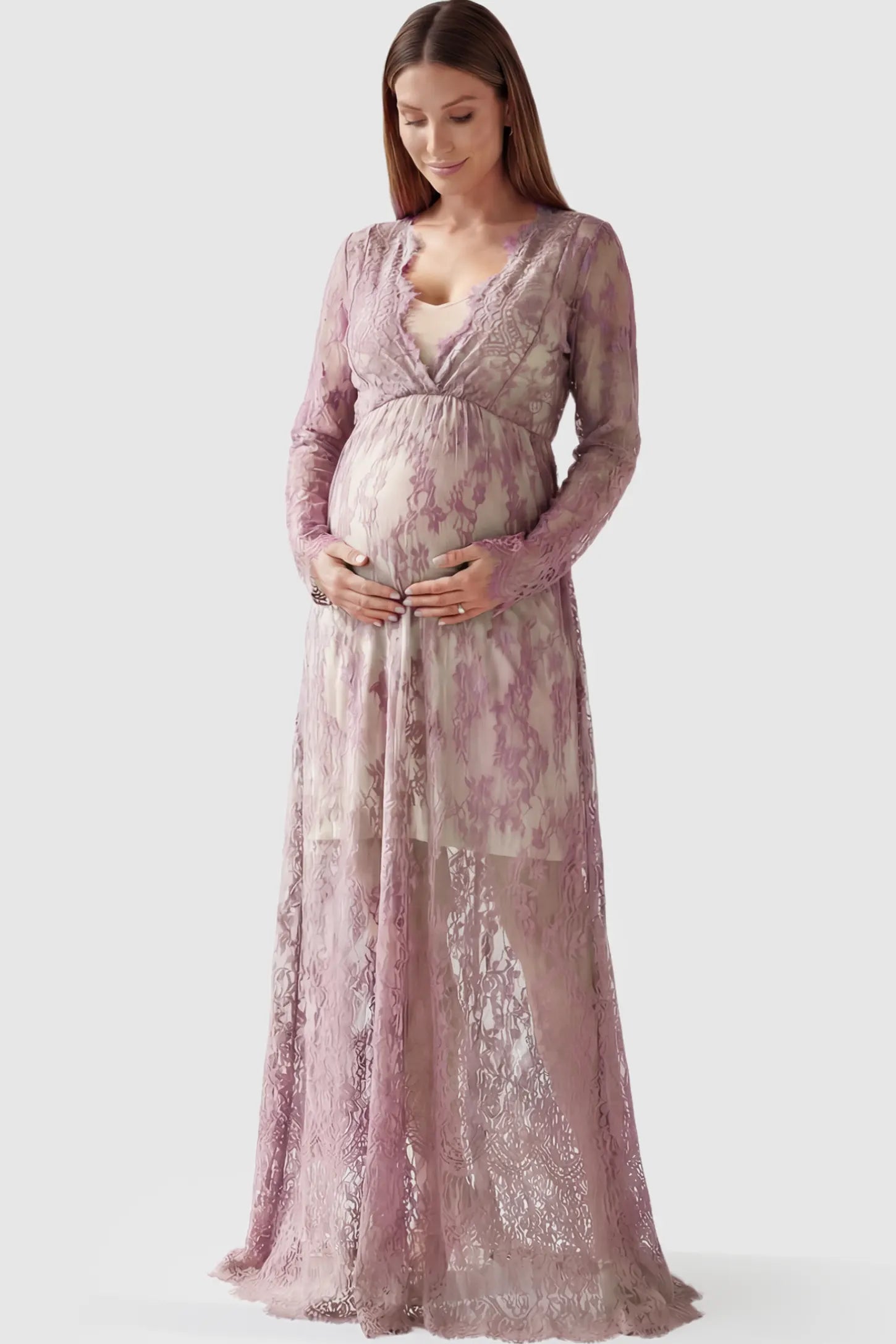 Floral Sheer Lace Long Sleeve Maternity Photoshoot Gown Floral Sheer Lace Maternity Gown in Dusty Mauve featuring scalloped v-neck and long sleeves on a pregnant model showing front.