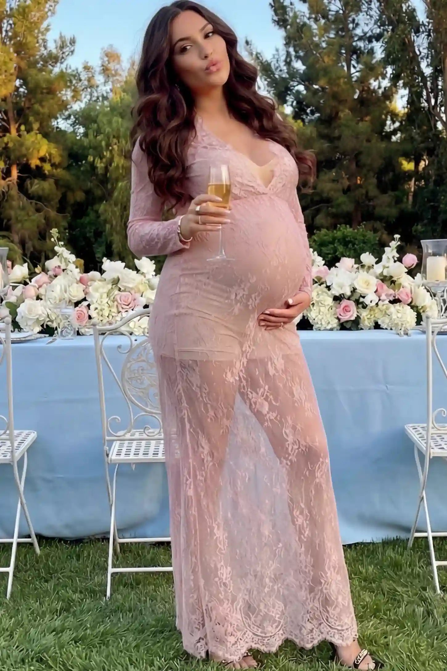 Floral Sheer Lace Long Sleeve Maternity Photoshoot Gown Floral Sheer Lace Maternity Gown in Dusty Mauve featuring scalloped v-neck and long sleeves on a pregnant woman showing front.