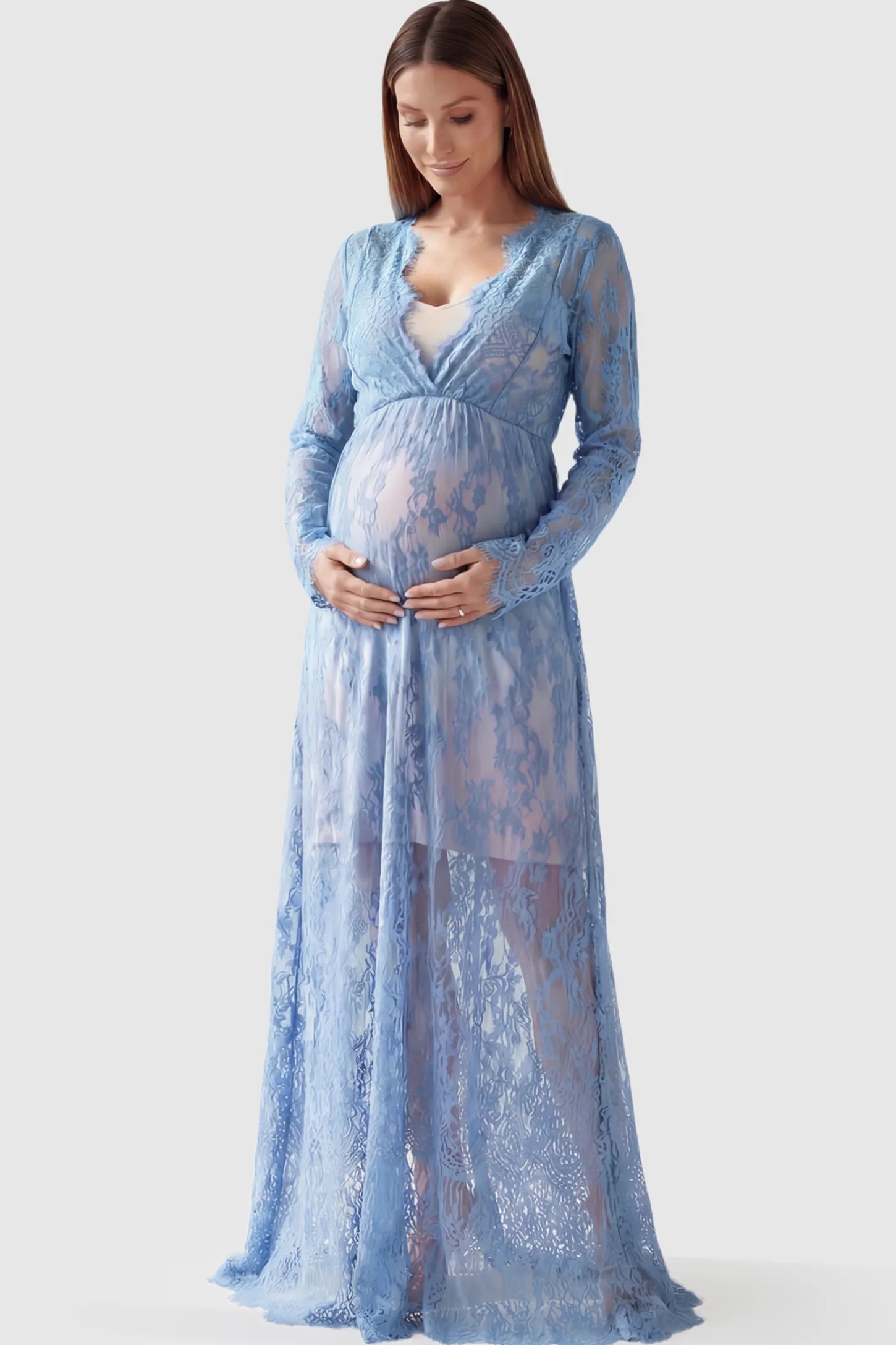 Floral Sheer Lace Long Sleeve Maternity Photoshoot Gown Floral Sheer Lace Maternity Gown in Light Blue featuring scalloped v-neck and long sleeves on a pregnant model showing front.