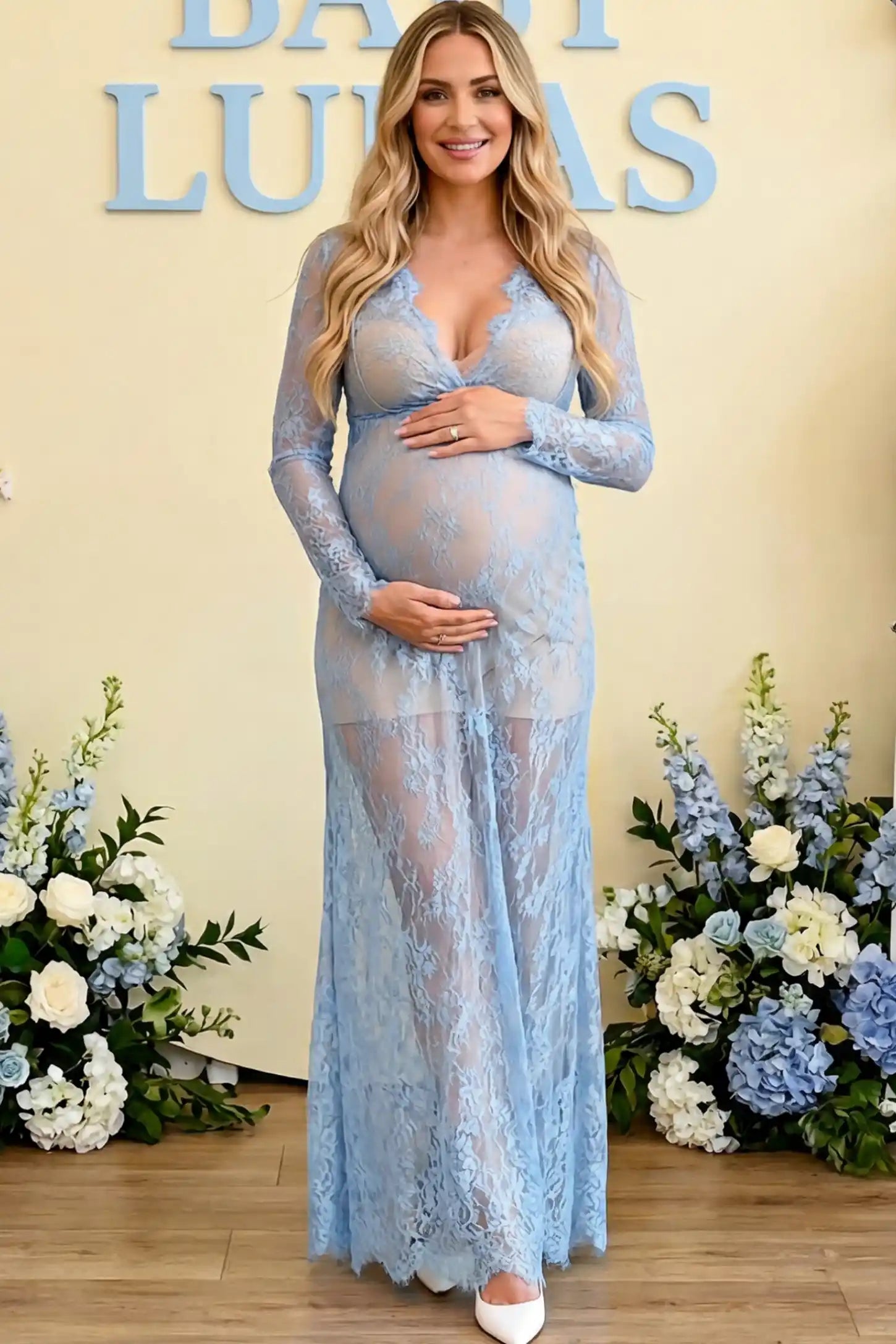 Floral Sheer Lace Long Sleeve Maternity Photoshoot Gown Floral Sheer Lace Maternity Gown in Light Blue featuring scalloped v-neck and long sleeves on a pregnant woman showing front.