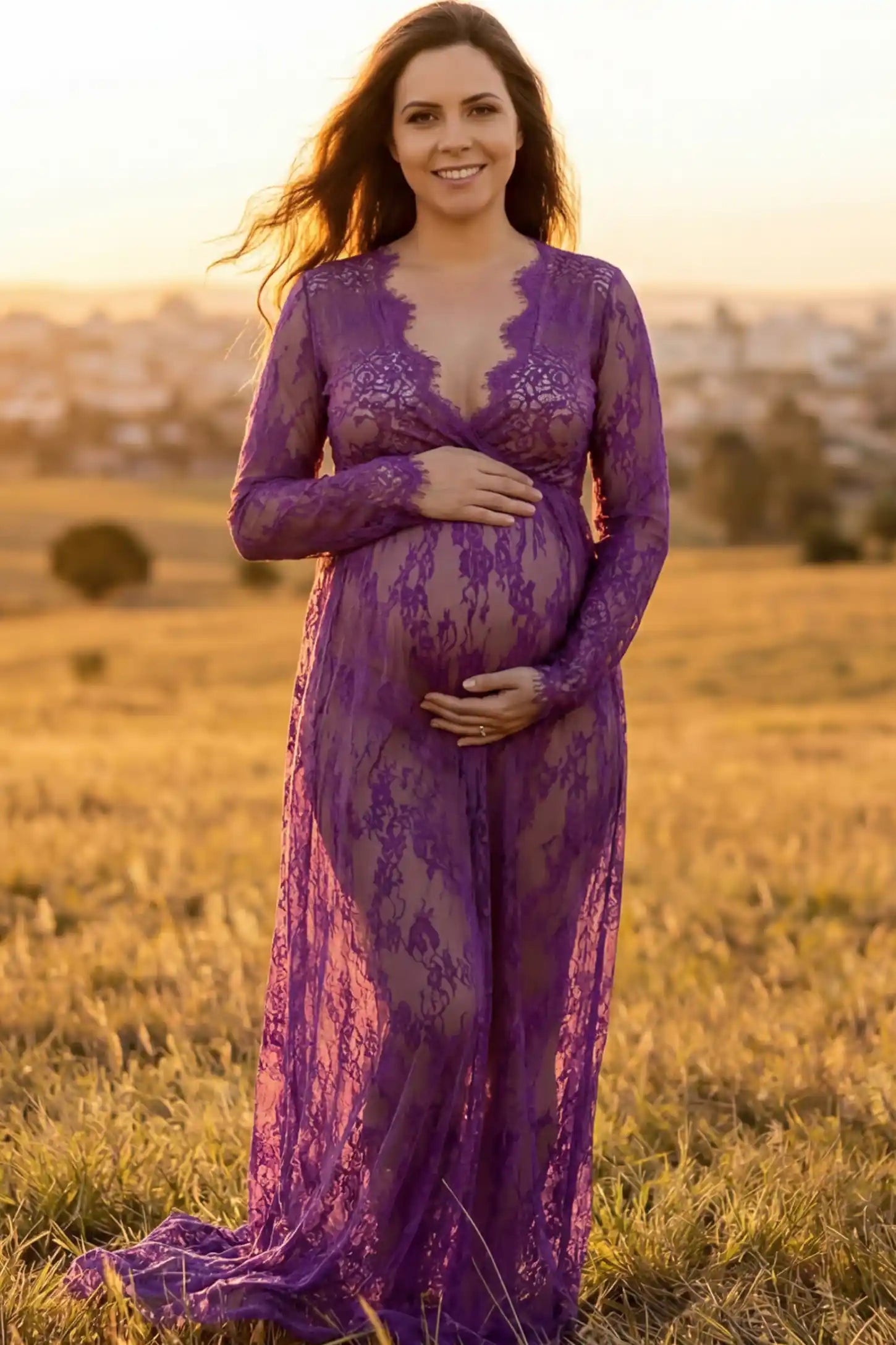Floral Sheer Lace Long Sleeve Maternity Photoshoot Gown Floral Sheer Lace Maternity Gown in Purple featuring scalloped v-neck and long sleeves on a pregnant woman showing front.