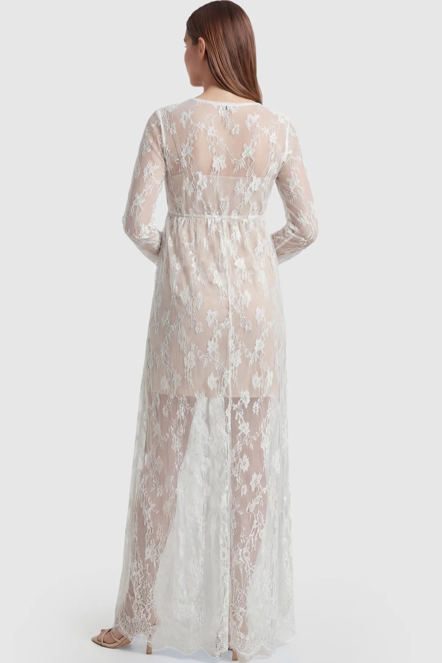 Floral Sheer Lace Long Sleeve Maternity Photoshoot Gown Floral Sheer Lace Maternity Gown in White featuring long sleeves on a pregnant model showing back.