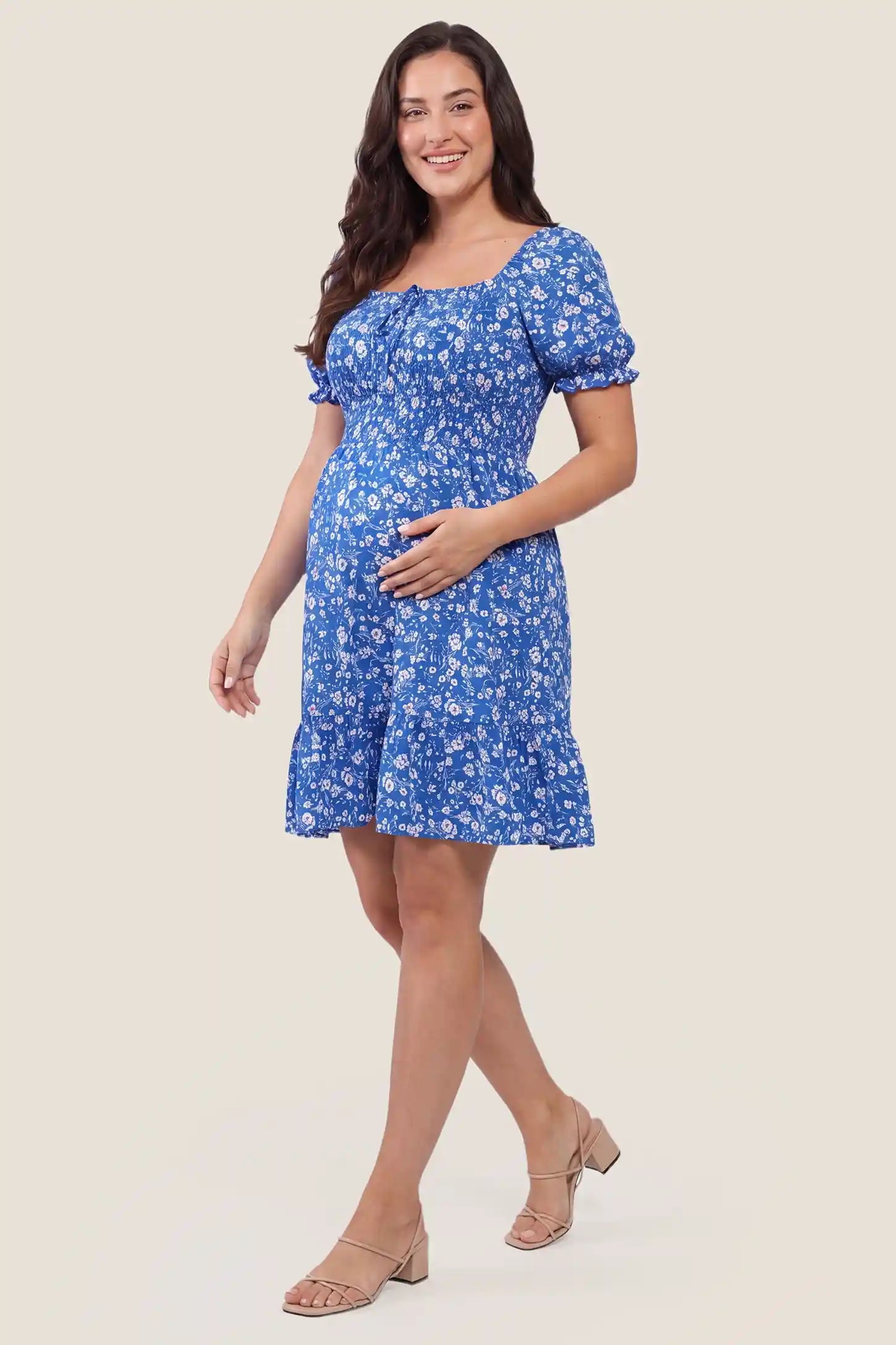 Floral Smocked Puff Sleeve Maternity Dress Floral Smocked Puff Sleeve Maternity Dress in Ocean Blue with sweet style, front view on a plus-size model.