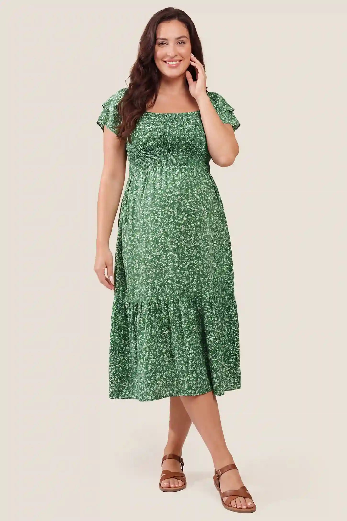 Floral Smocked Square Neck Tiered Maternity Midi Dress Floral Smocked Square Neck Tiered Maternity Midi Dress in Peacock Green featuring a smocked bodice, square neckline, and tiered midi skirt, front view on a pregnant model.