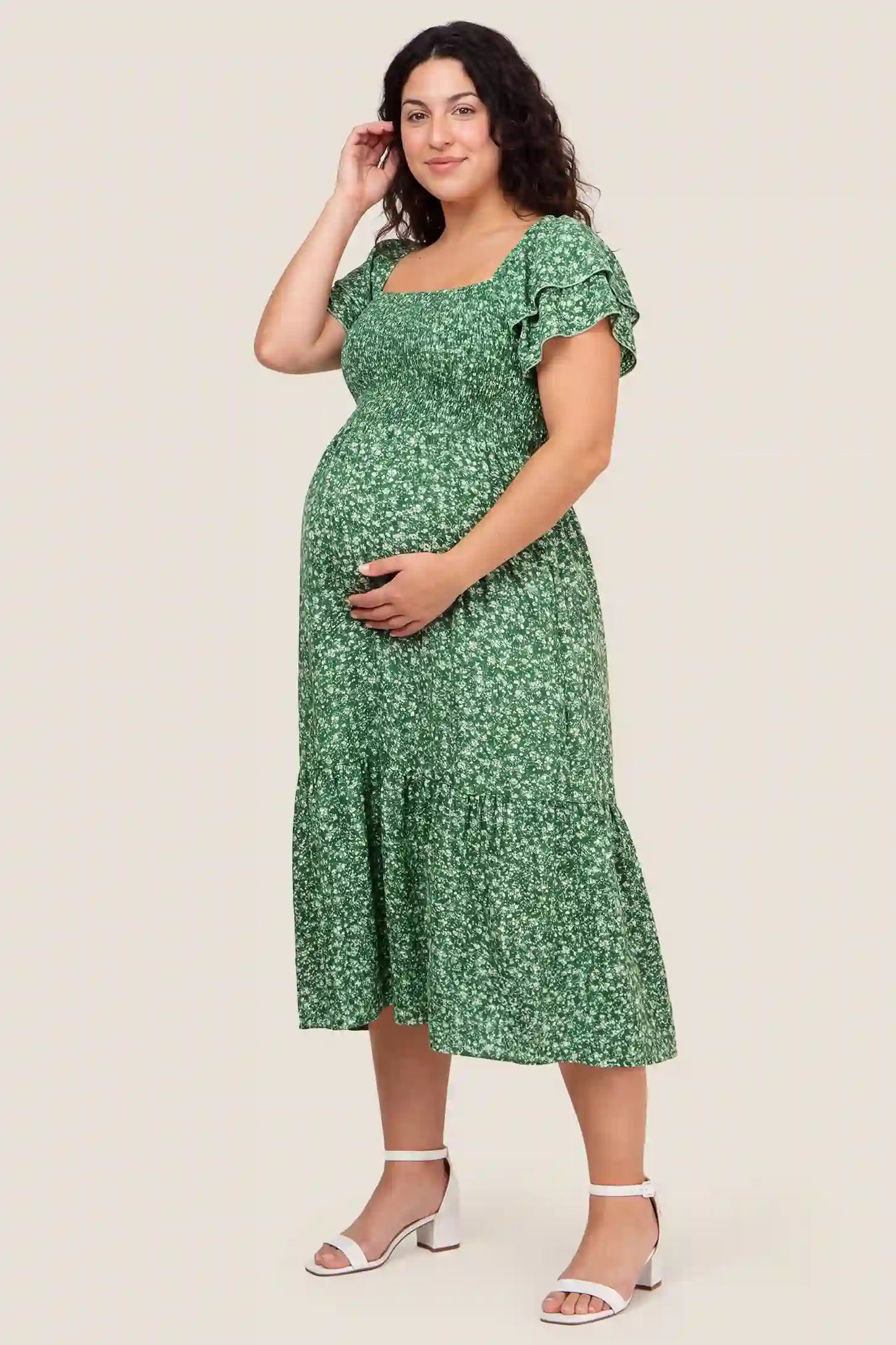 Floral Smocked Square Neck Tiered Maternity Midi Dress Floral Smocked Square Neck Tiered Maternity Midi Dress in Peacock Green with a smocked tiered design, front view on a plus-size model.