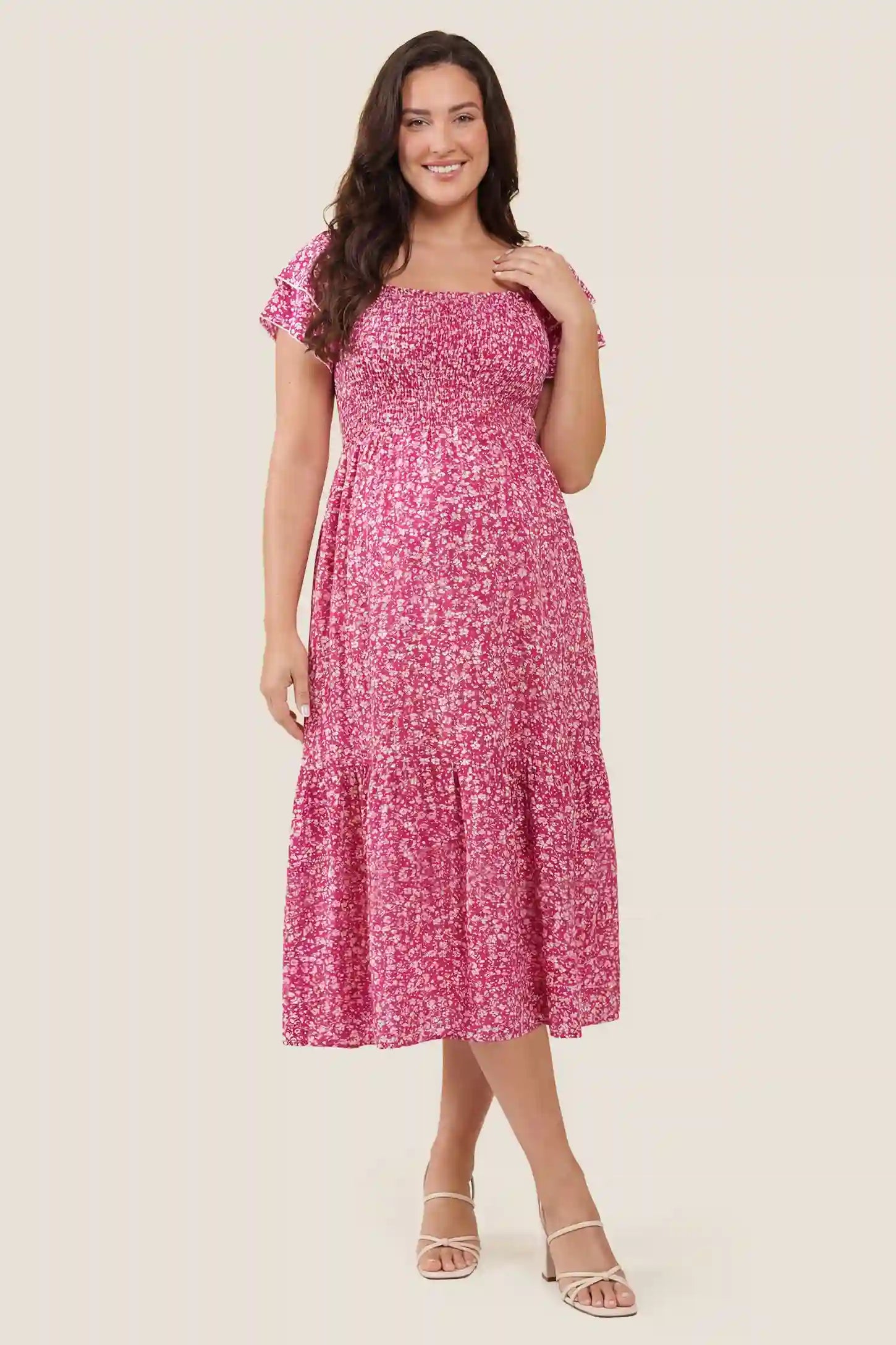 Floral Smocked Square Neck Tiered Maternity Midi Dress Floral Smocked Square Neck Tiered Maternity Midi Dress in Rose Red featuring a stretchy smocked bodice and square neckline, front view on a pregnant model.
