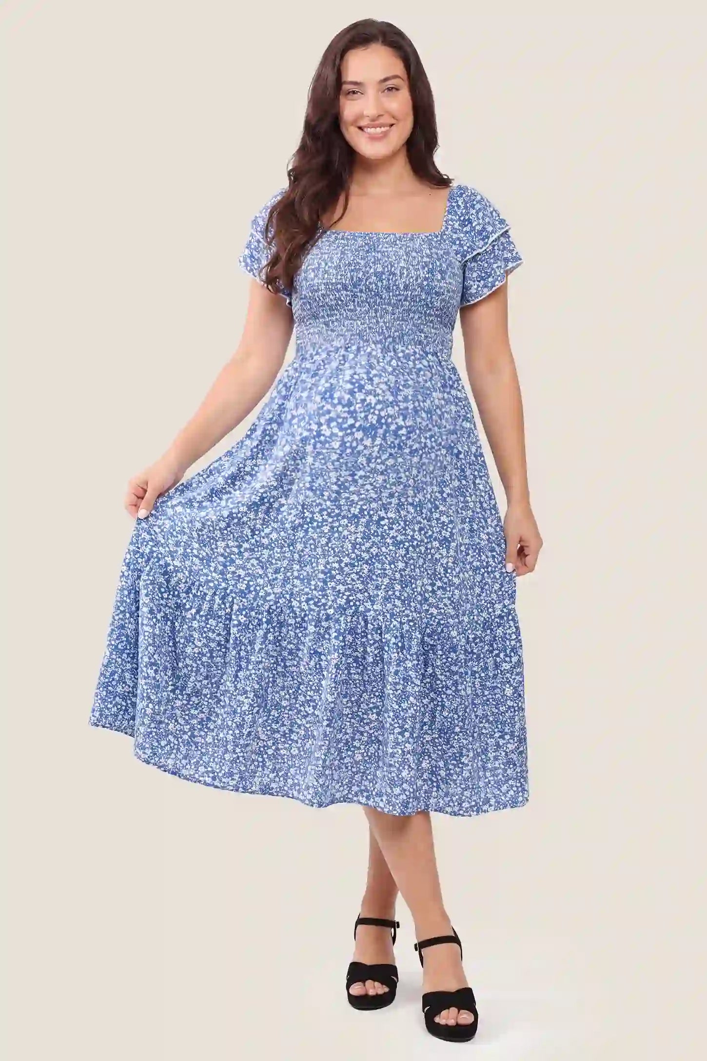 Floral Smocked Square Neck Tiered Maternity Midi Dress Floral Smocked Square Neck Tiered Maternity Midi Dress in Royal Blue featuring a smocked bodice, square neckline, and tiered midi skirt, front view on a pregnant model.