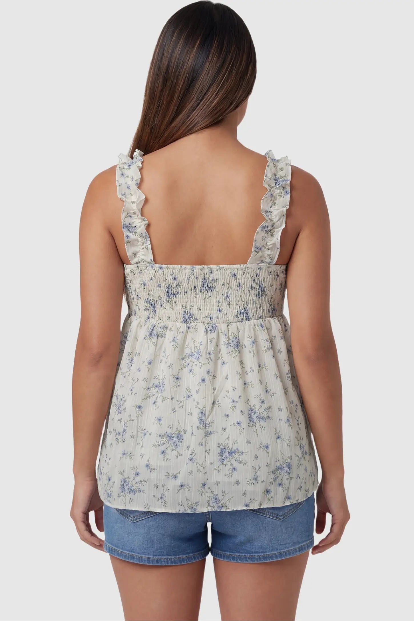 Floral Square Neck Babydoll Maternity Top Floral Square Neck Babydoll Maternity Top in Beige featuring a square smocked back and ruffle straps on a pregnant model, back view.