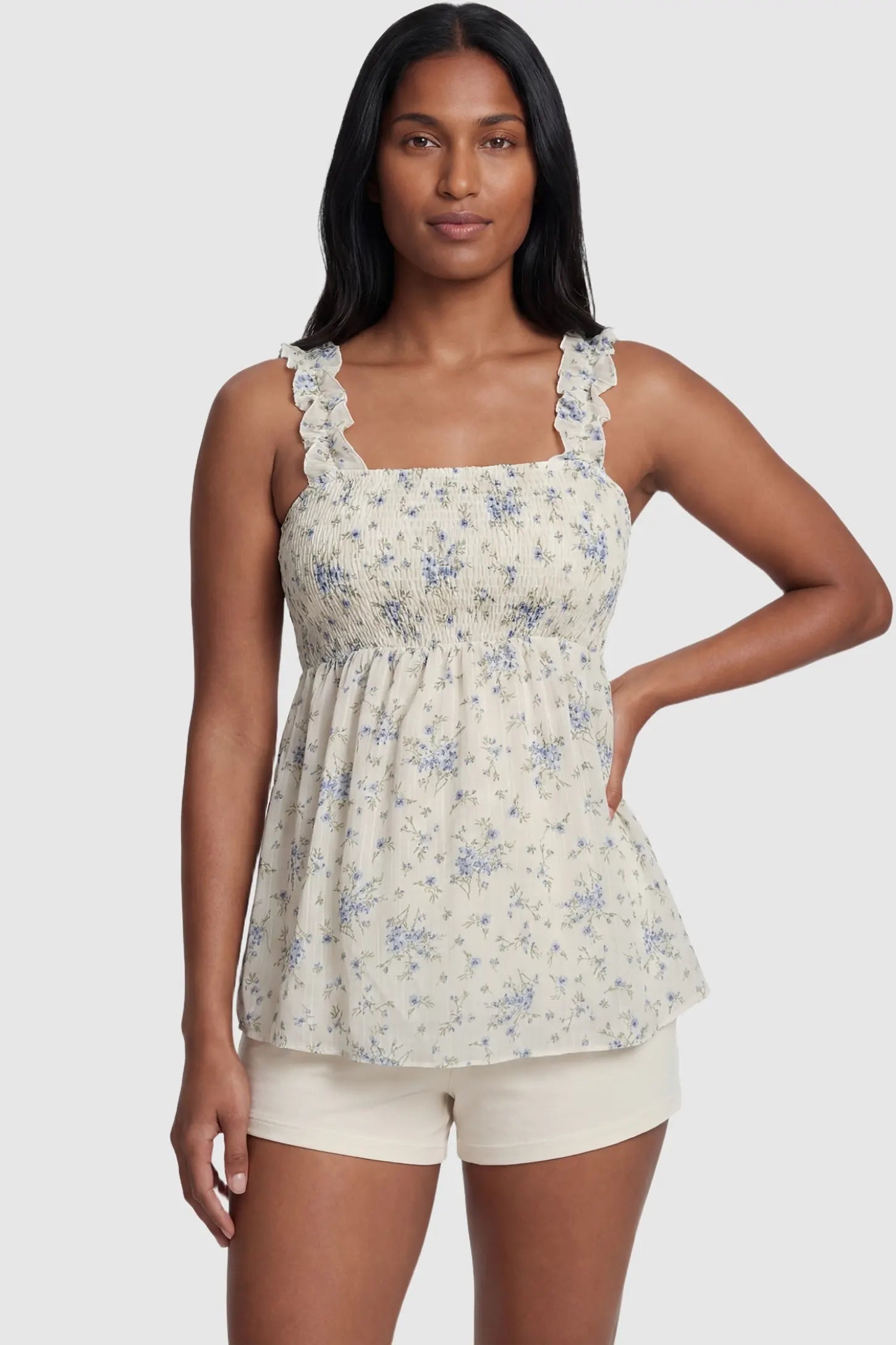 Floral Square Neck Babydoll Maternity Top Floral Square Neck Babydoll Maternity Top in Beige featuring a smocked bodice and relaxed babydoll fit on a non-pregnant model, front view.