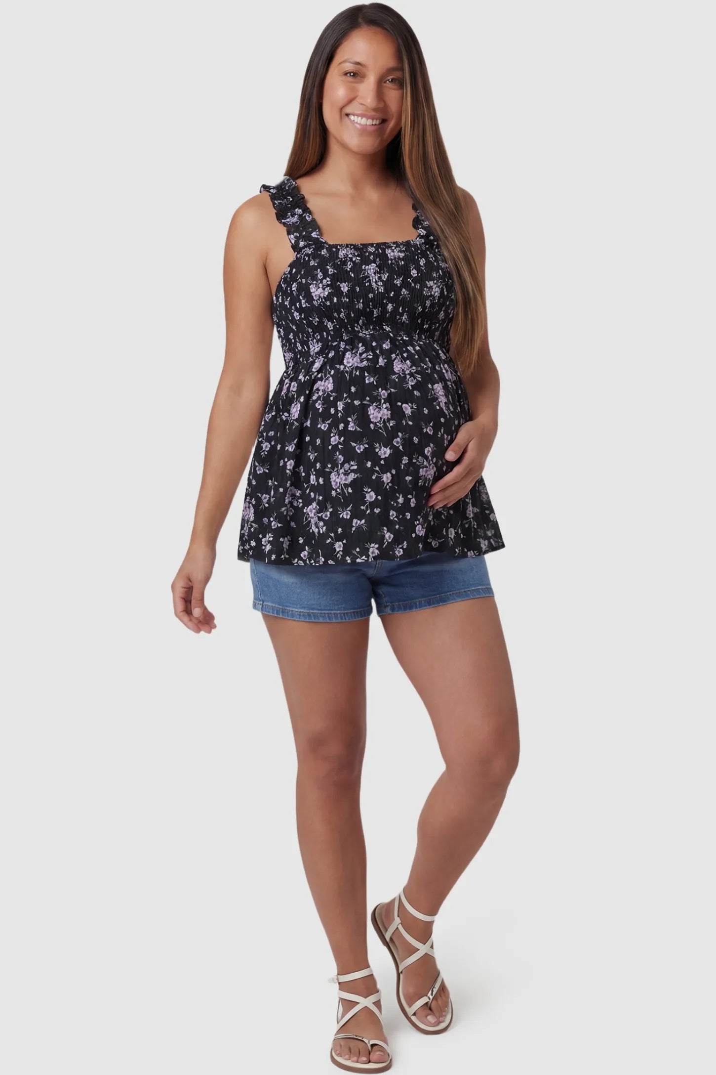 Floral Square Neck Babydoll Maternity Top Floral Square Neck Babydoll Maternity Top in Black featuring a smocked bodice and flowy babydoll hem on a pregnant model, front view.