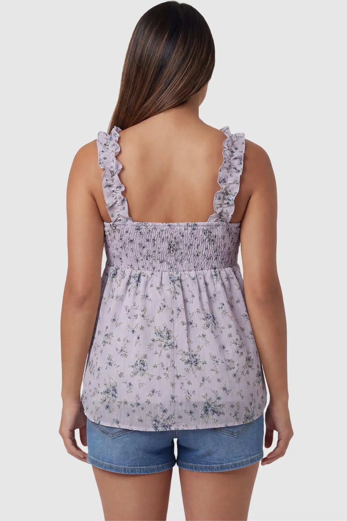 Floral Square Neck Babydoll Maternity Top Floral Square Neck Babydoll Maternity Top in Purple featuring a smocked back and ruffle straps on a pregnant model, back view.