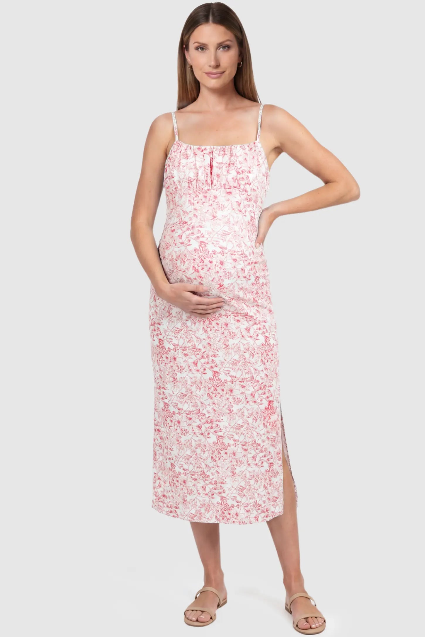 Floral Square Neck Side Ruched Maternity Midi Dress Floral Square Neck Side Ruched Maternity Midi Dress in Pink featuring a botanical print and sleeveless cut on a pregnant model, front view.