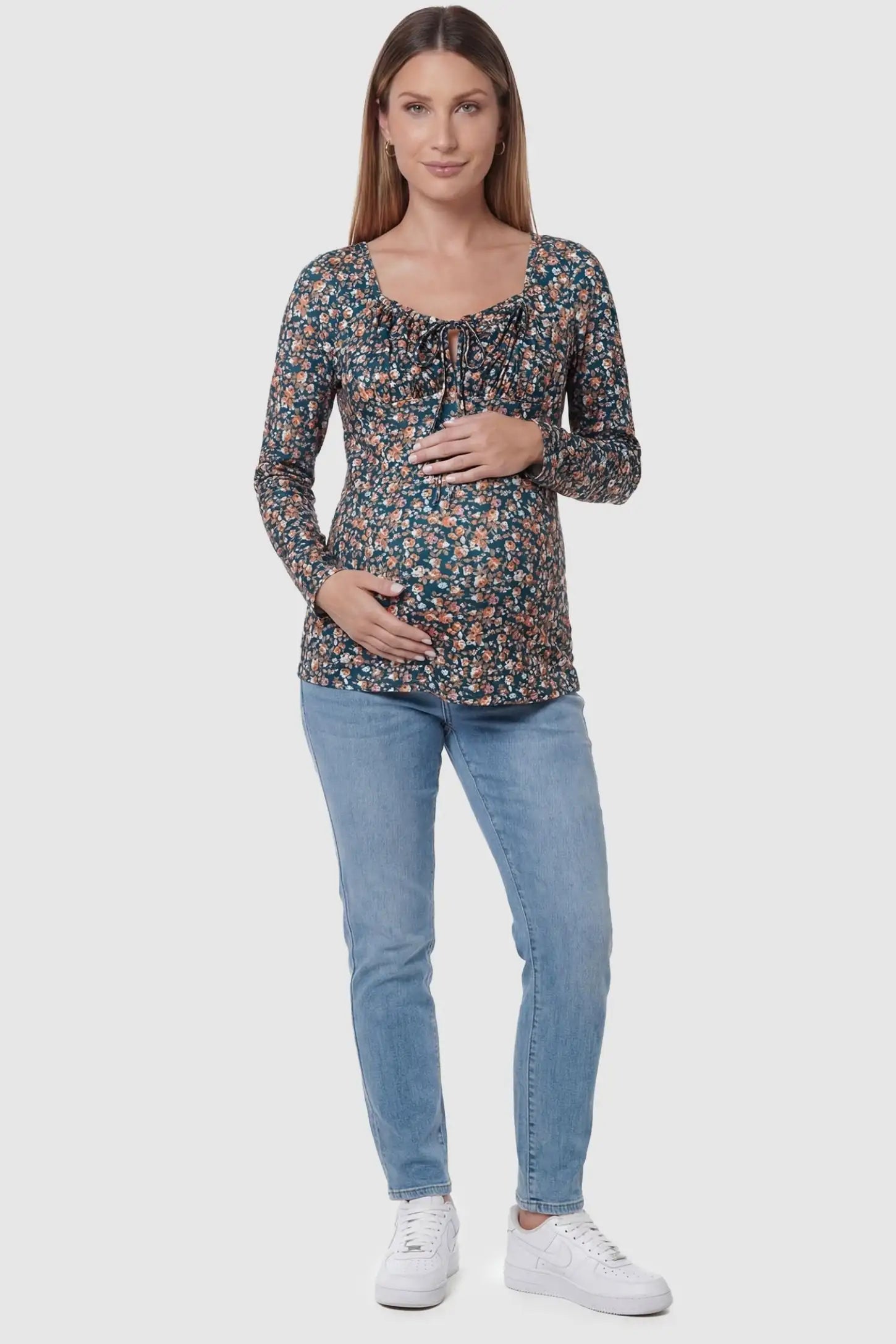Floral Square Neck Maternity Top Floral Square Neck Maternity Top in floral print featuring a smocked bodice on a pregnant model in a full body image.