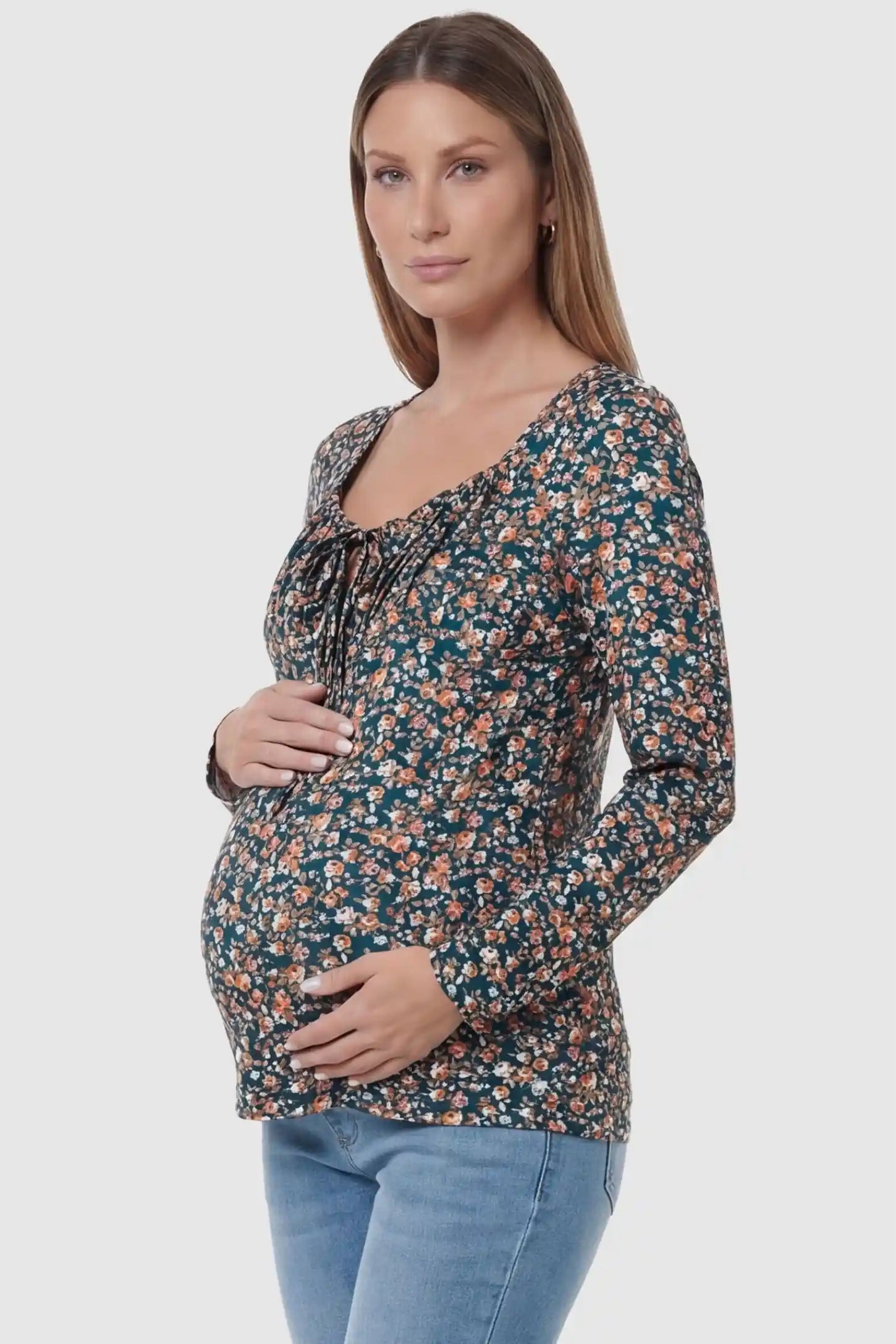 Floral Square Neck Maternity Top in floral print featuring a smocked bodice in side view on a pregnant model.
