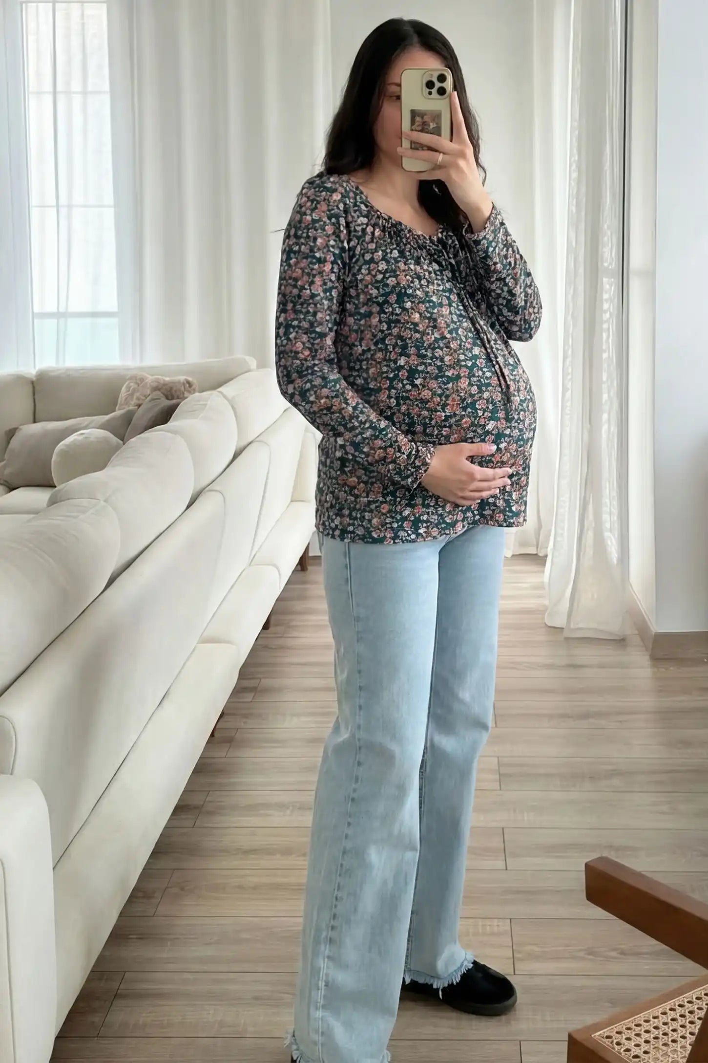 Floral Square Neck Maternity Top Floral Square Neck Maternity Top in floral print featuring a smocked bodice on a pregnant model in a social proof image.