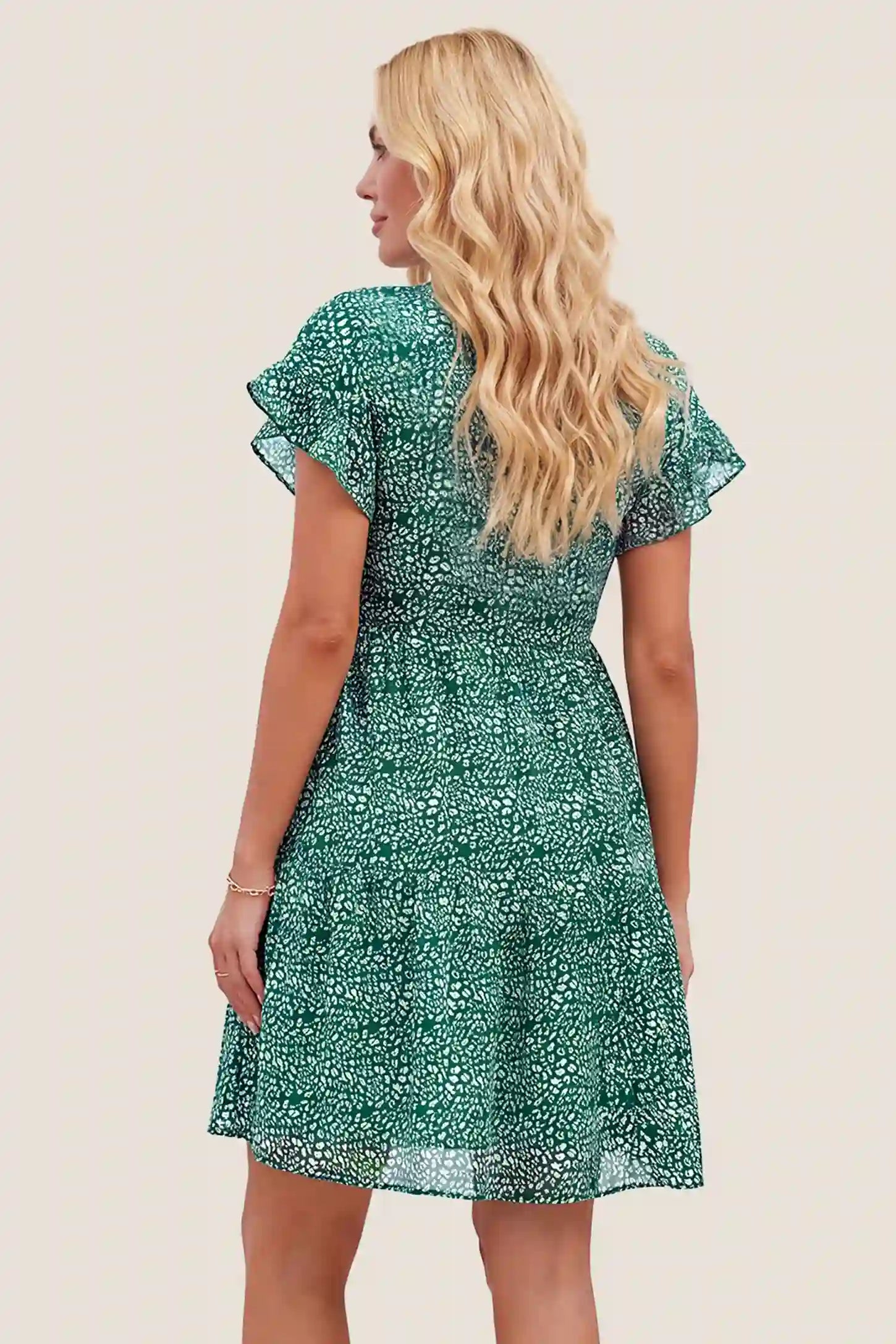 Floral V-Neck A-Line Flutter Sleeve Short Maternity Dress Floral V-Neck A-Line Flutter Sleeve Short Maternity Dress in Green showcasing lightweight fabric drape, back view on a pregnant model.