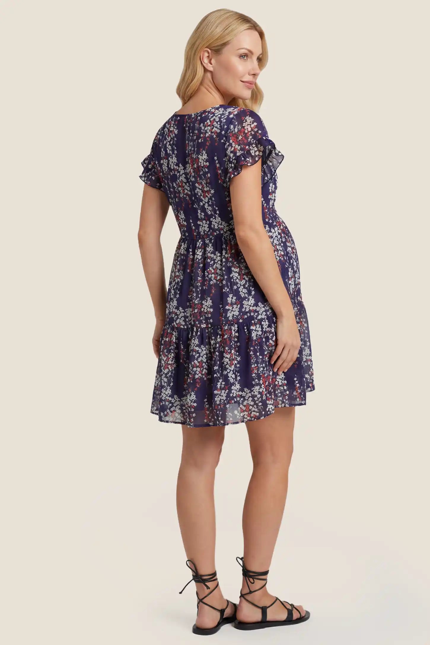 Floral V-Neck A-Line Flutter Sleeve Short Maternity Dress Floral V-Neck A-Line Flutter Sleeve Short Maternity Dress in Navy Blue showcasing lightweight fabric drape, back view on a pregnant model.