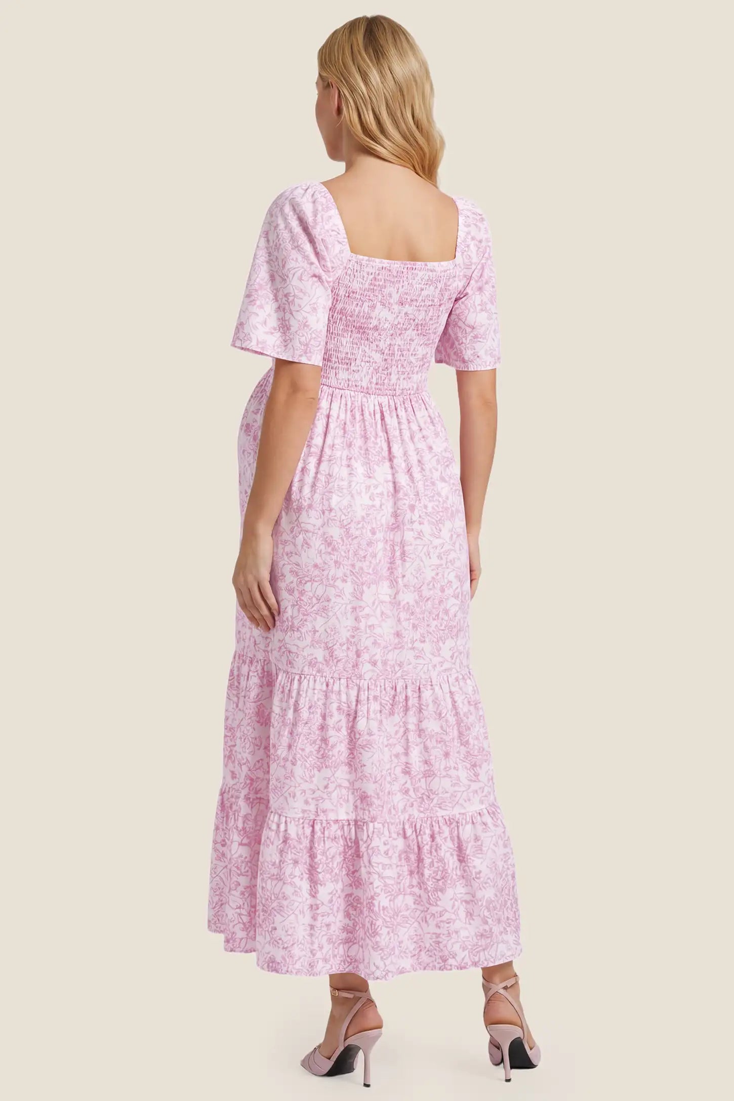 Floral V-Neck Flutter Sleeve Maternity Midi Dress Floral V-Neck Flutter Sleeve Maternity Midi Dress in Pink Floral with a stretchy smocked back, back view on a pregnant model.
