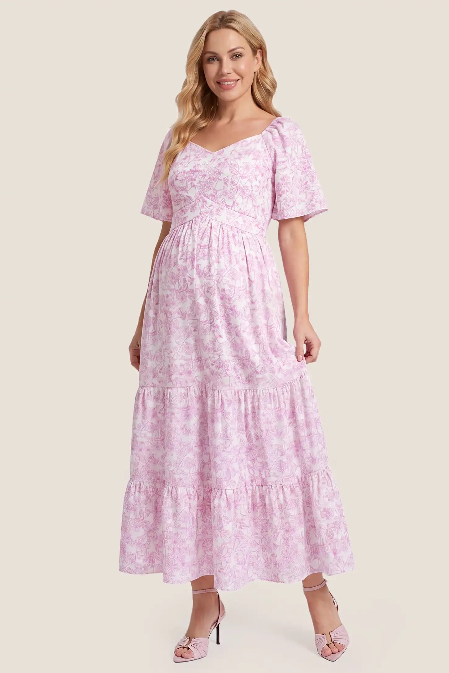 Floral V-Neck Flutter Sleeve Maternity Midi Dress Floral V-Neck Flutter Sleeve Maternity Midi Dress in Pink Floral featuring a V-neckline, front view on a pregnant model.