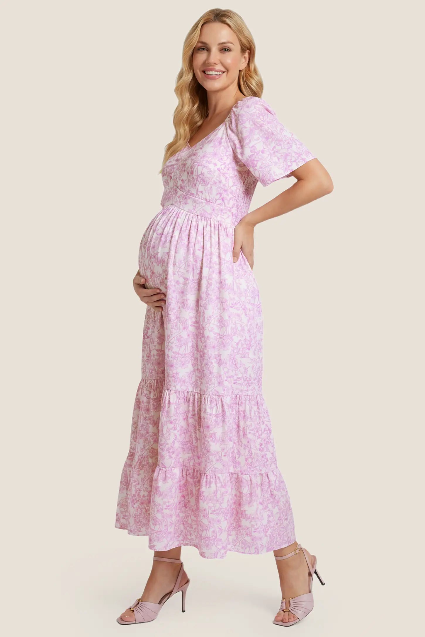Floral V-Neck Flutter Sleeve Maternity Midi Dress Floral V-Neck Flutter Sleeve Maternity Midi Dress in Pink Floral showcasing flutter sleeves and tiered skirt, side view on a pregnant model.
