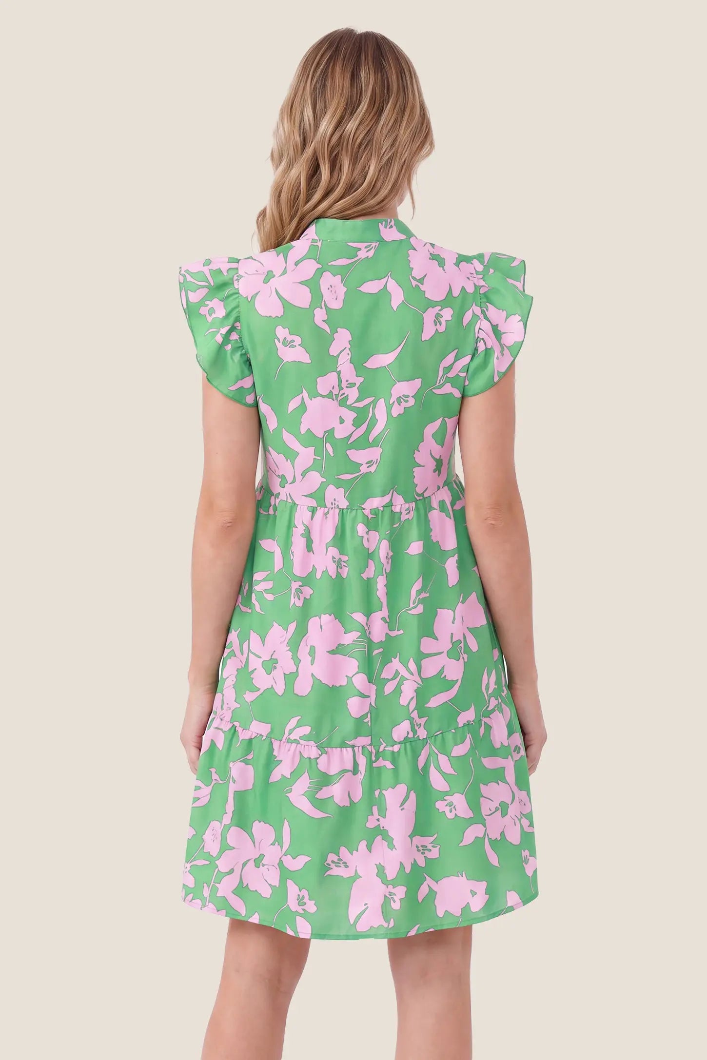 Floral Print V-Neck Flutter Sleeve Maternity Short Dress Floral Print V-Neck Flutter Sleeve Maternity Short Dress in Green showcasing the flutter sleeves and tiered hem design, back view on a pregnant model.