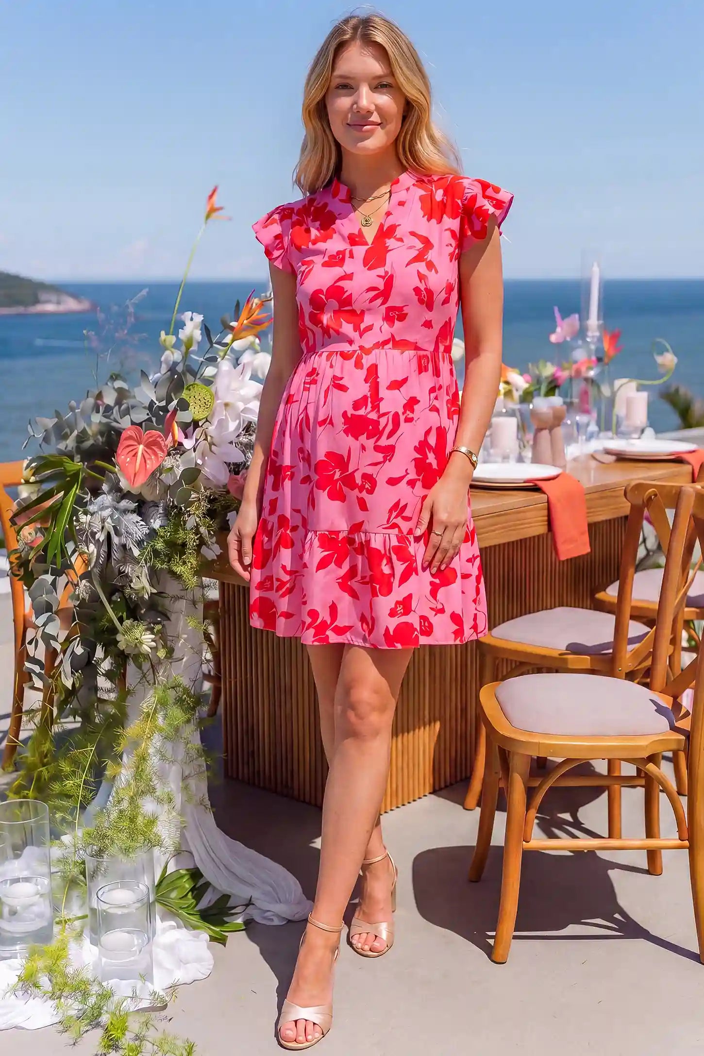 Floral Print V-Neck Flutter Sleeve Maternity Short Dress Floral Print V-Neck Flutter Sleeve Maternity Short Dress in Red with red floral pattern, lifestyle view on a pregnant model.