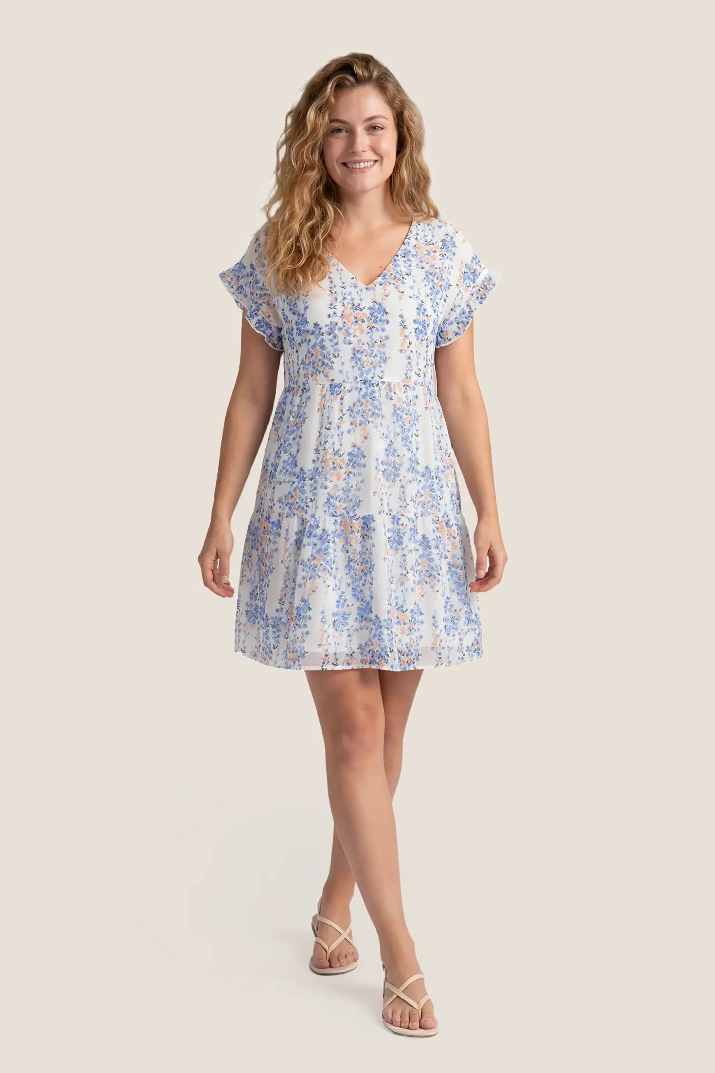 Floral V-Neck A-Line Flutter Sleeve Short Maternity Dress Floral V-Neck Flutter Sleeve Tiered Maternity Mini Dress in White-Blue with cascading tiered design, front view on a non pregnant model.