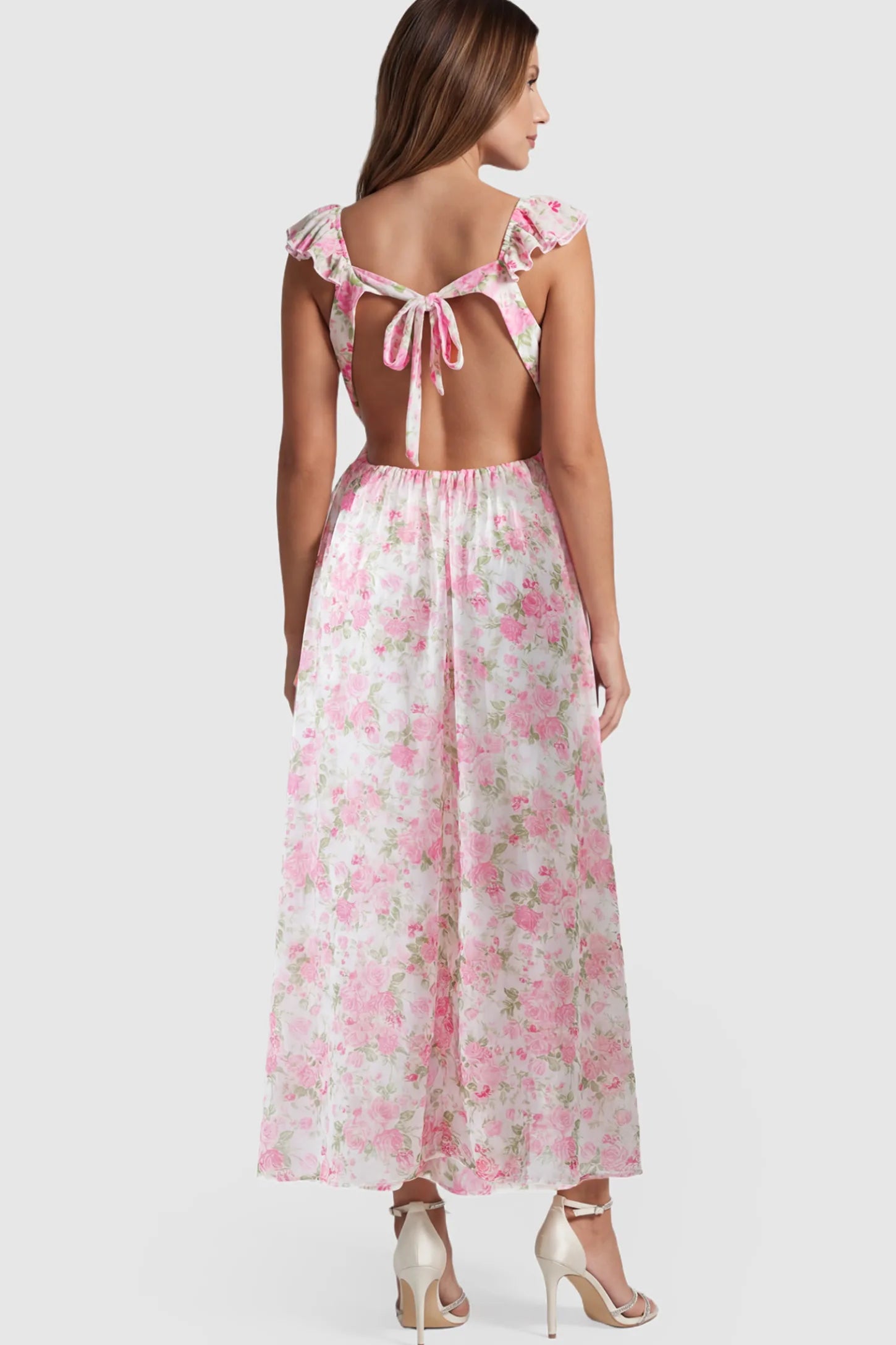 Floral V-Neck Ruffle Backless Maternity Maxi Dress Floral Print V-Neck Ruffle Backless Maxi Maternity Dress featuring an adjustable tie-back and open-back detail showing back.