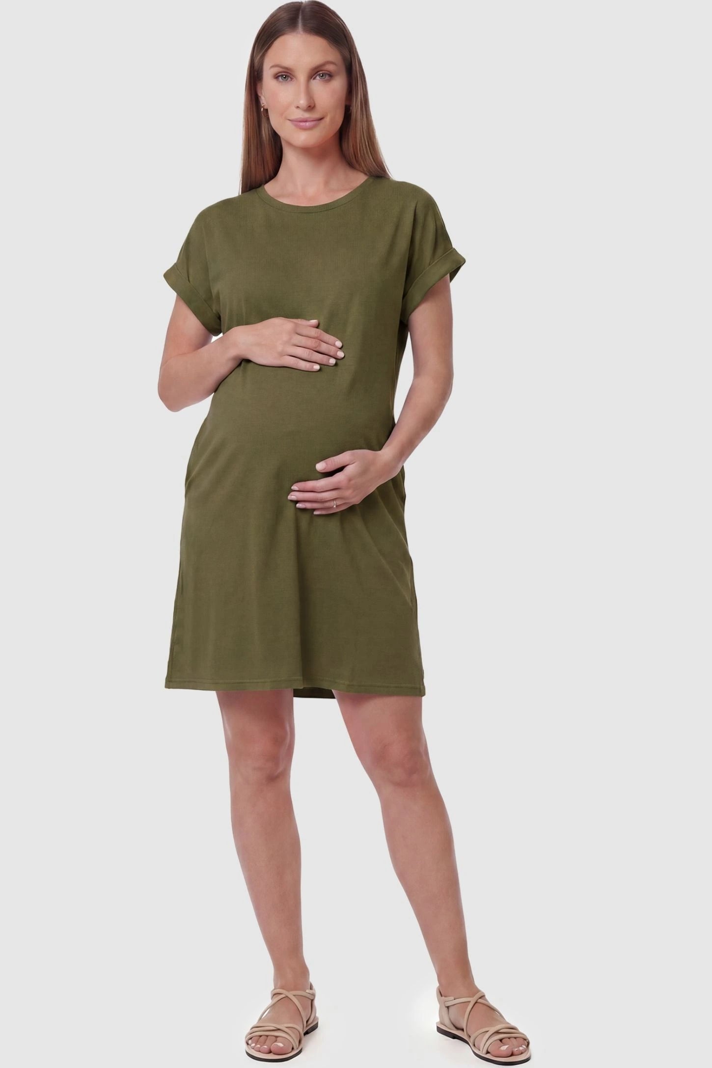 Flowy Pocket Tunic Maternity T-Shirt Dress Flowy Pocket Tunic Maternity T-Shirt Dress in Army Green featuring a relaxed fit on a front-view pregnant model.