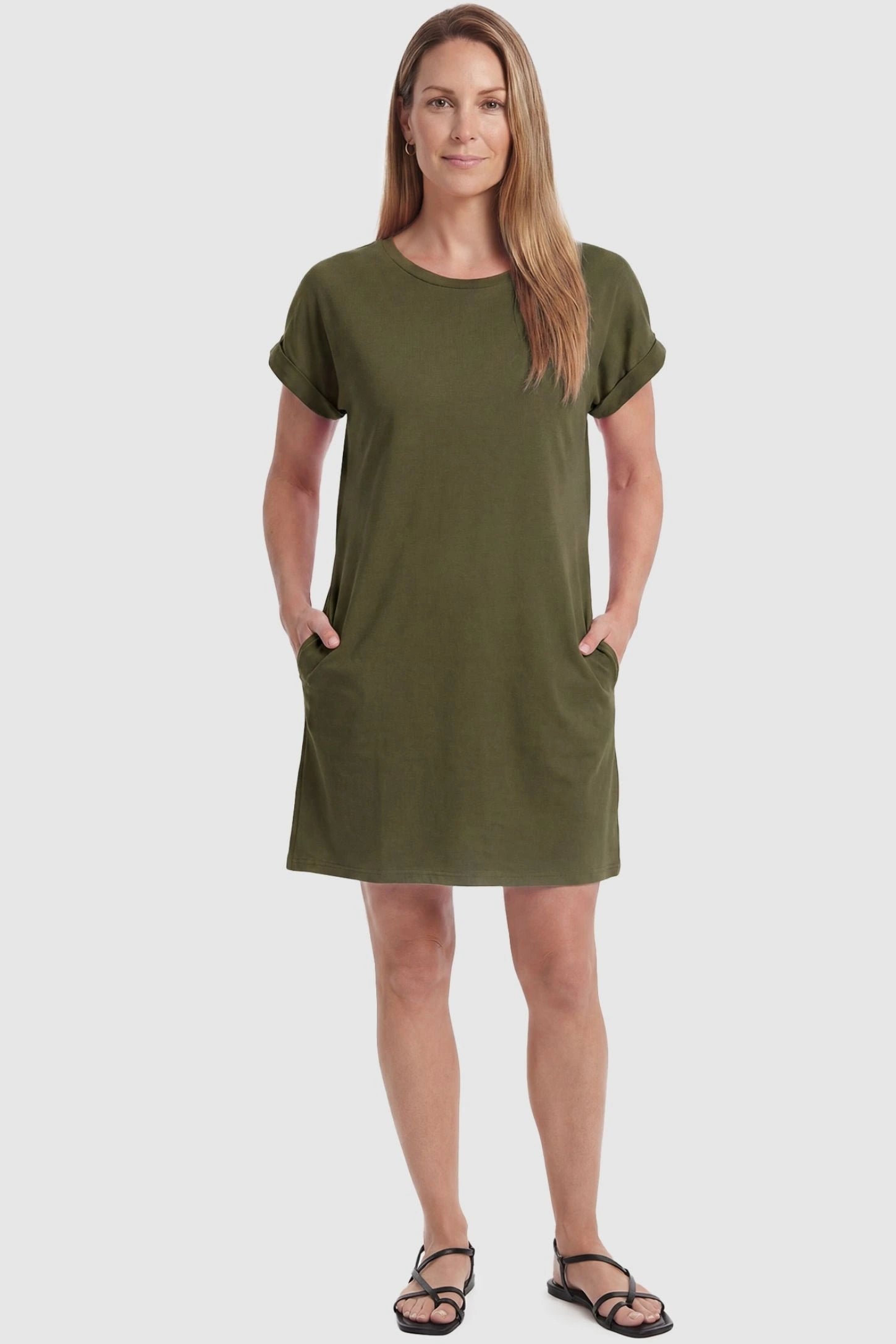 Flowy Pocket Tunic Maternity T-Shirt Dress Flowy Pocket Tunic Maternity T-Shirt Dress in Army Green featuring cuffed short sleeves on a front-view postpartum model.